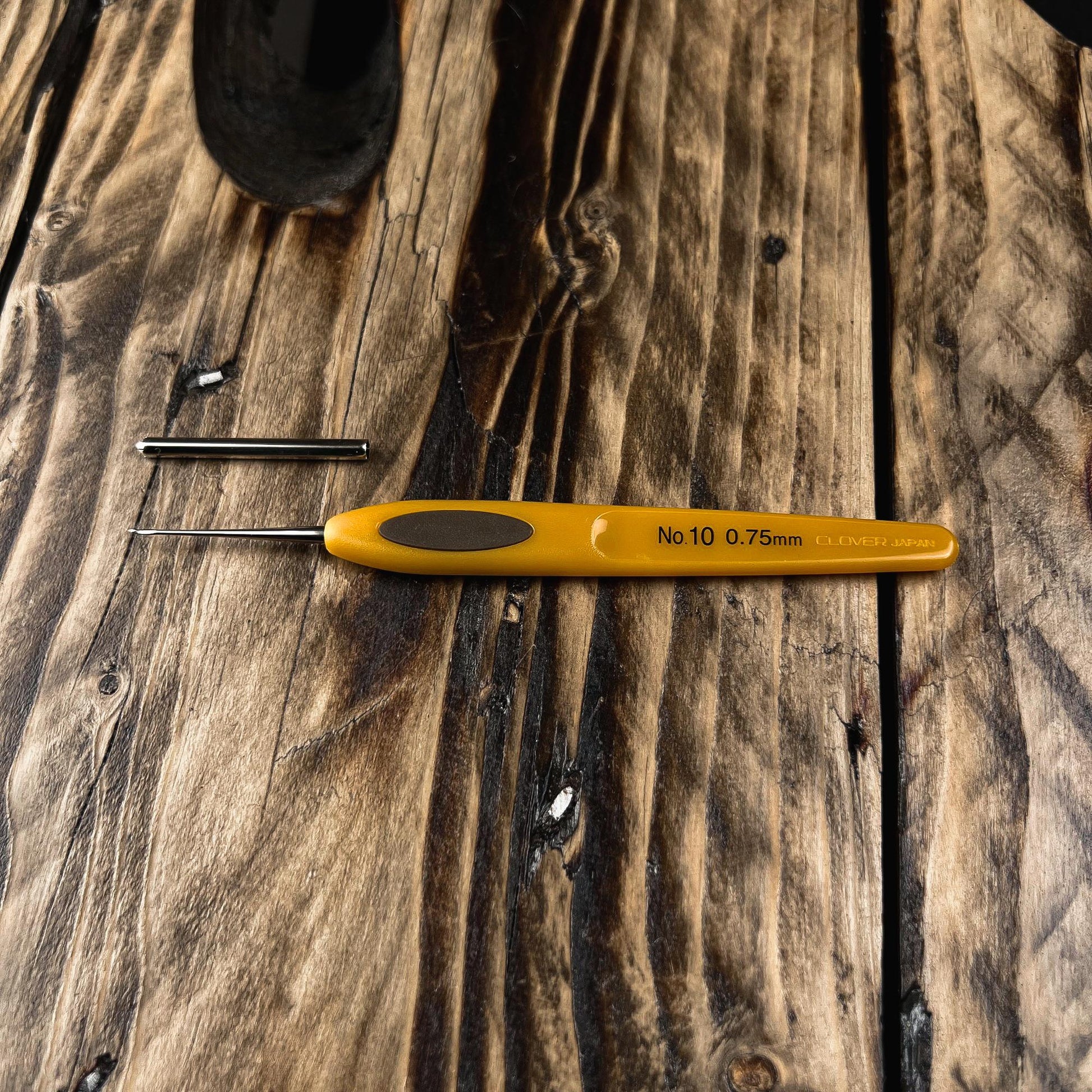 Clover Micro Crochet Hook No. 10 (0.75 mm) for precise Loc maintenance and detailed Dreadlock work.