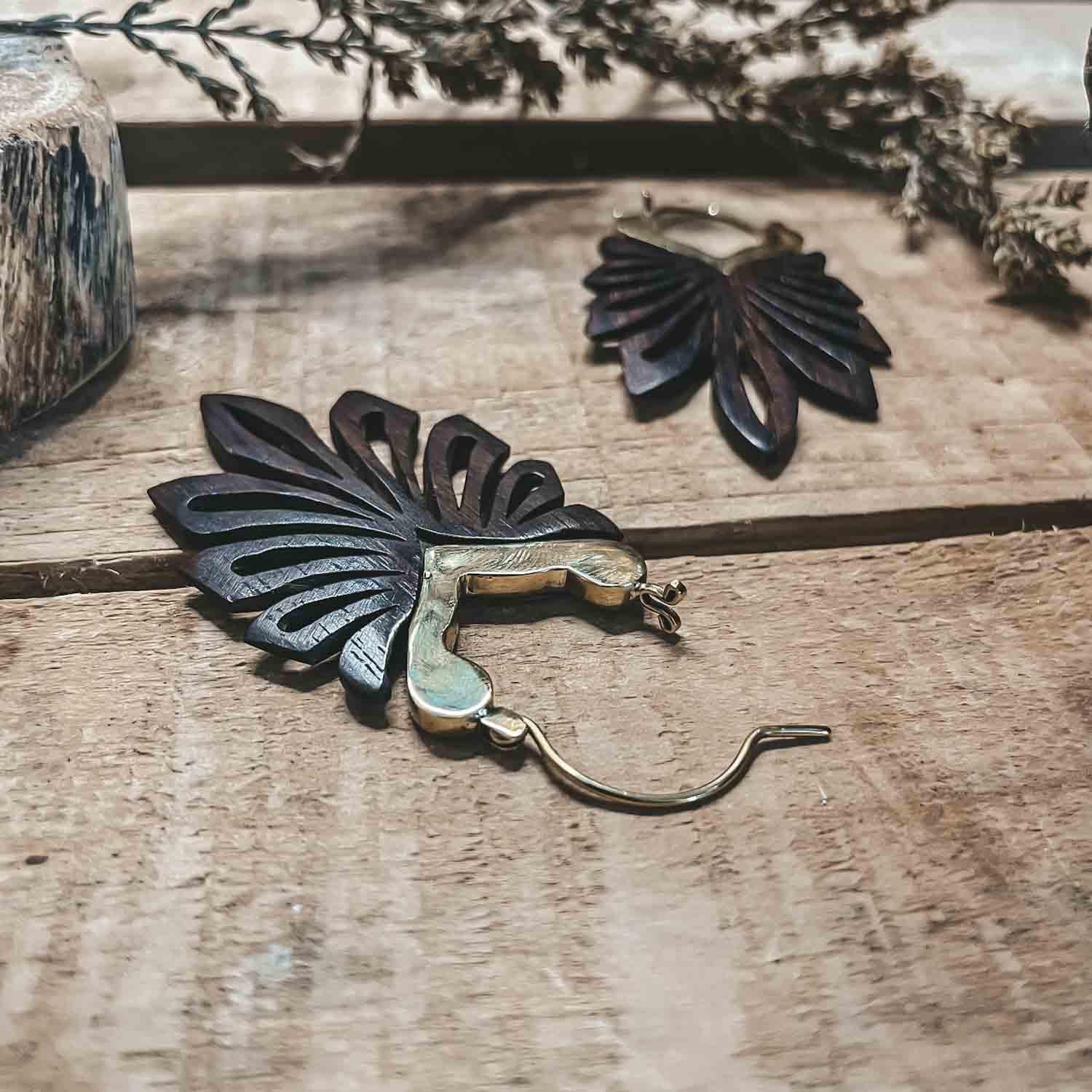 Close up of CrafterElena Jungle Earrings with carved leaf design