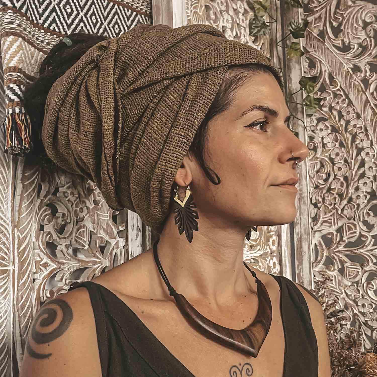 Person wearing CrafterElena Jungle Earrings made from sono wood