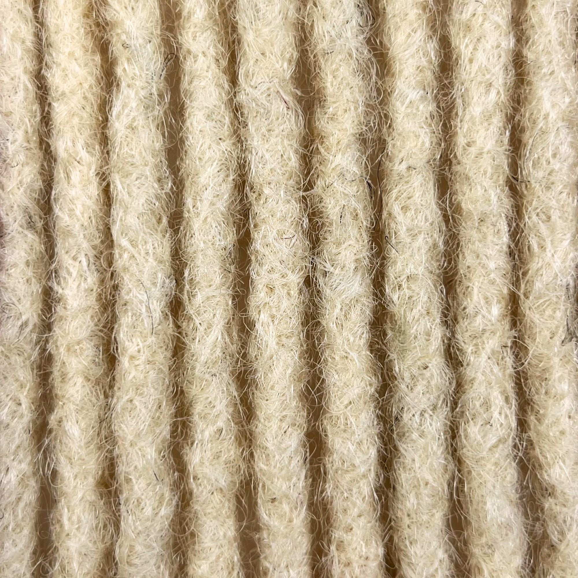 Close-up of Bleach Blonde kinky human hair loc extensions made using the crochet method.