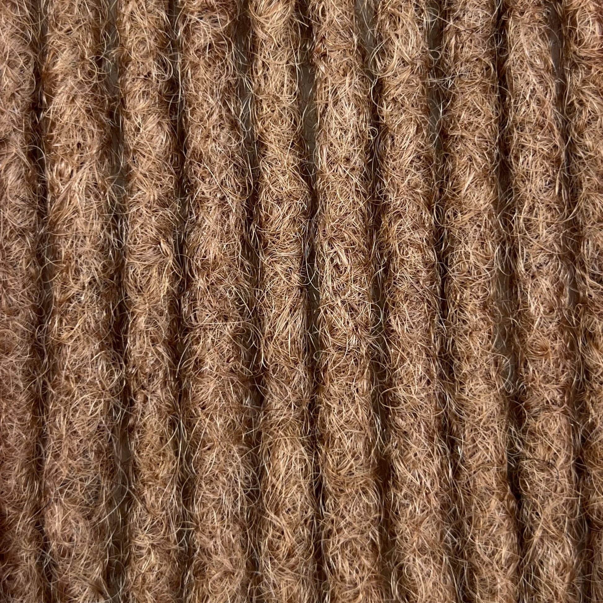 Close-up of Dark Blonde kinky human hair loc extensions made using the crochet method.