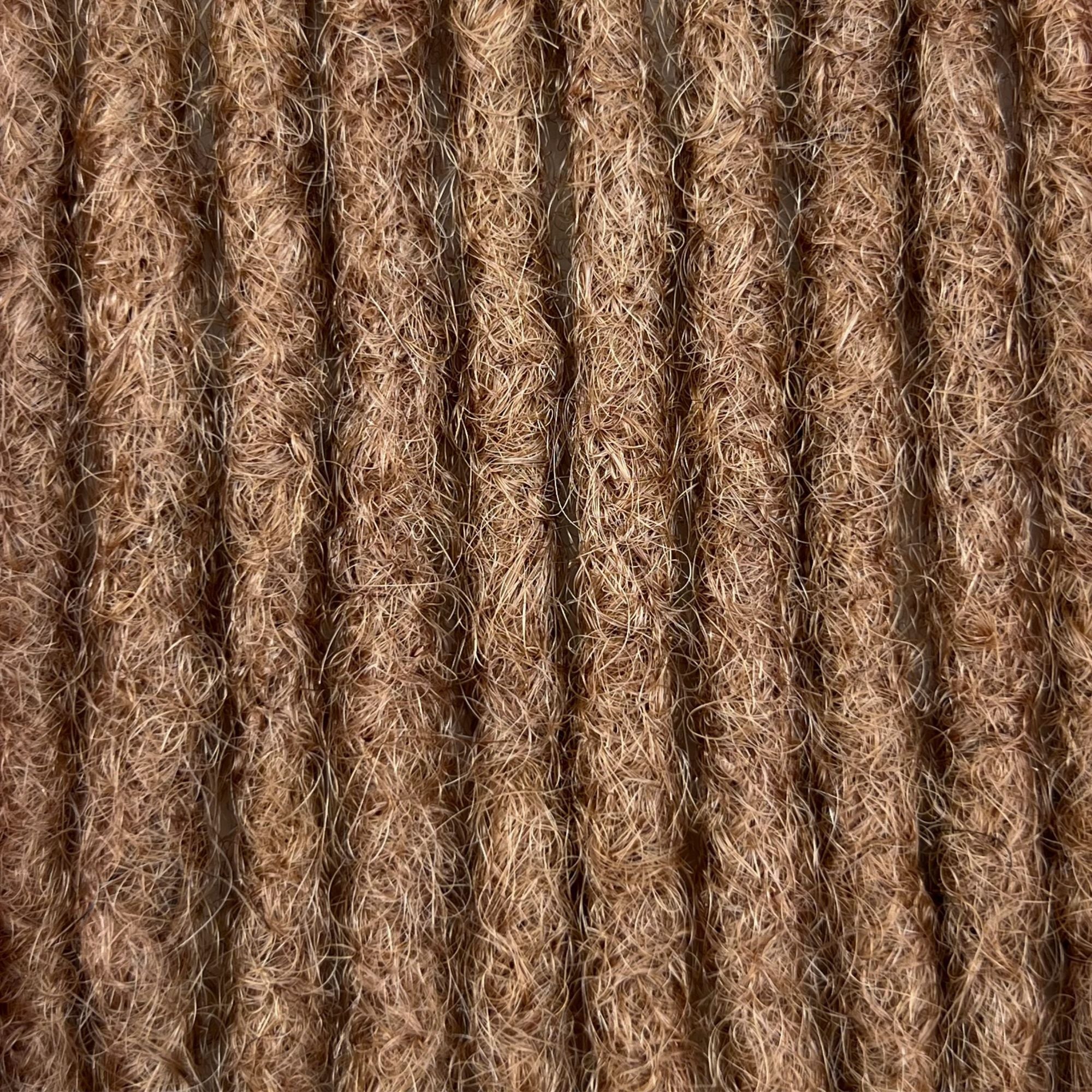 Close-up of Dark Blonde kinky human hair loc extensions made using the crochet method.
