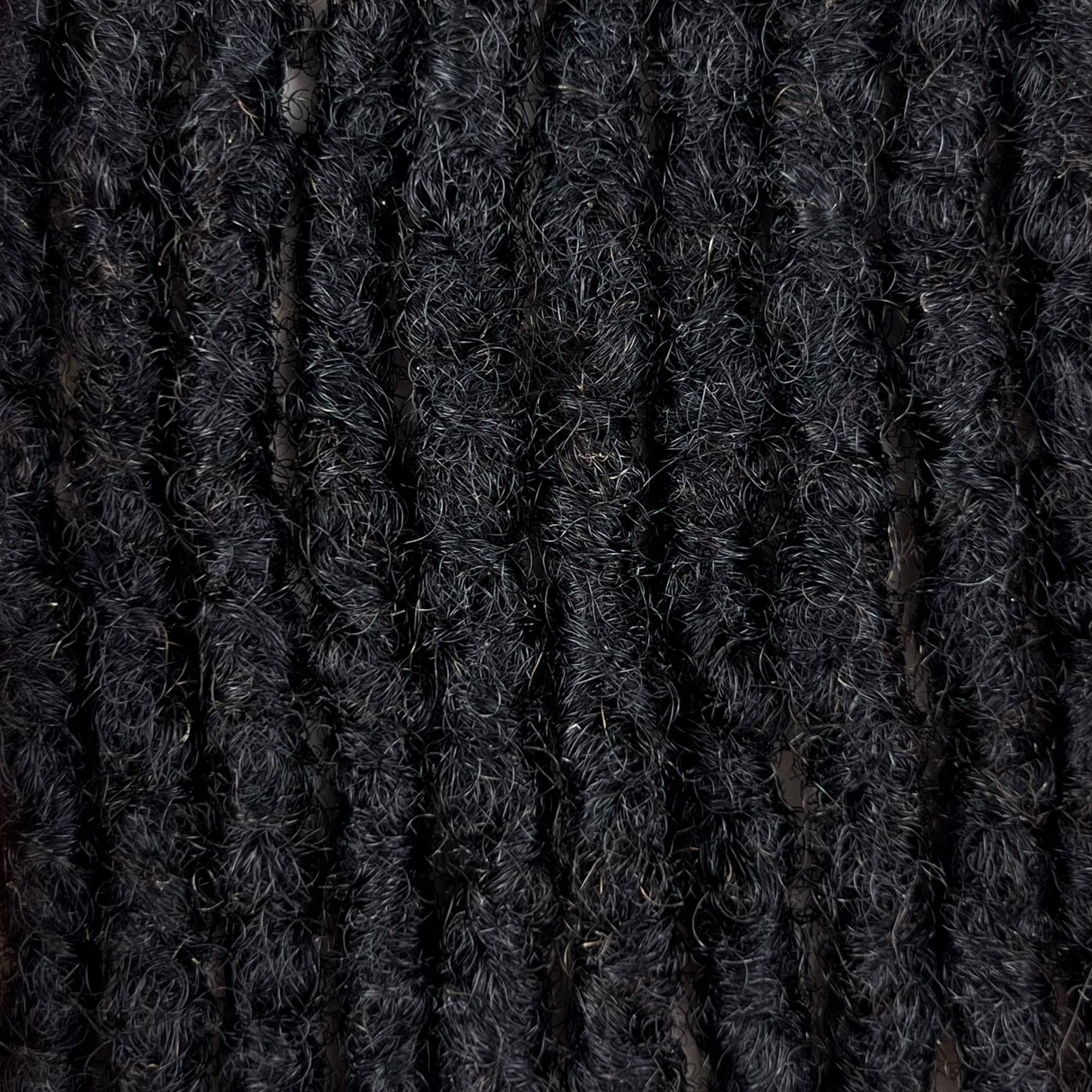 Close-up of Dark Brown kinky human hair loc extensions made using the interlocking method.