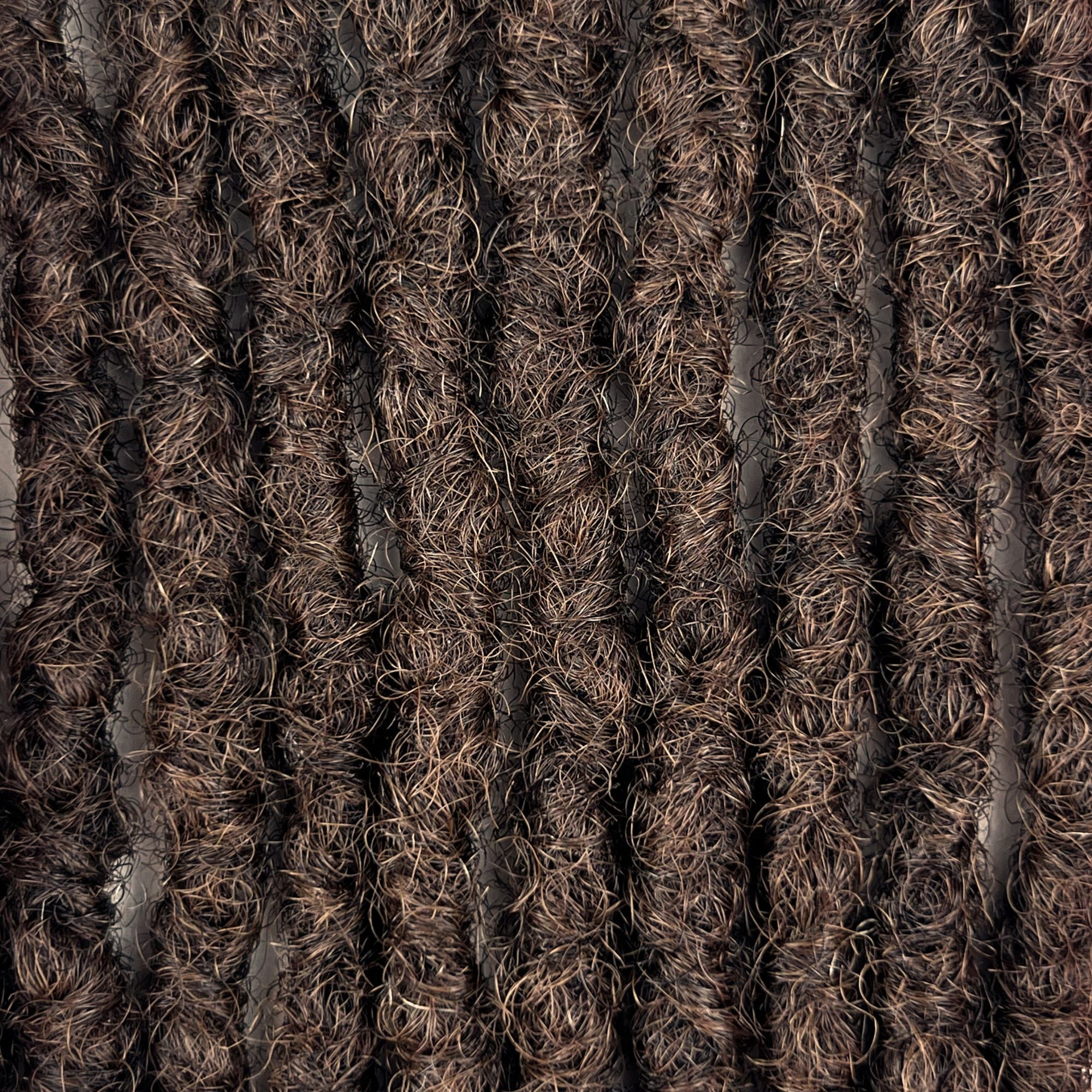 Close-up of Medium Brown kinky human hair loc extensions made using the interlocking method.
