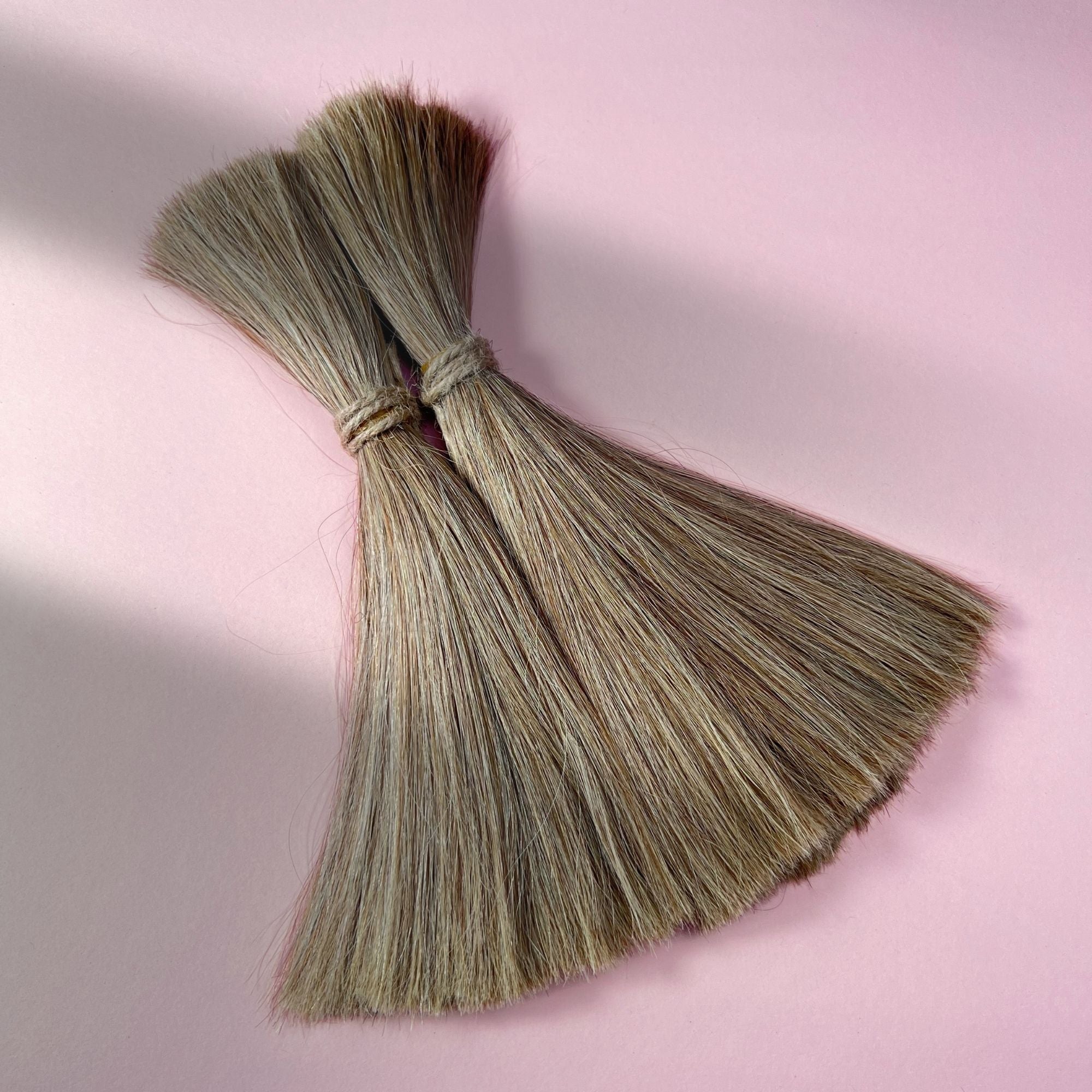 Full view of straight human hair in Sandy Blonde.