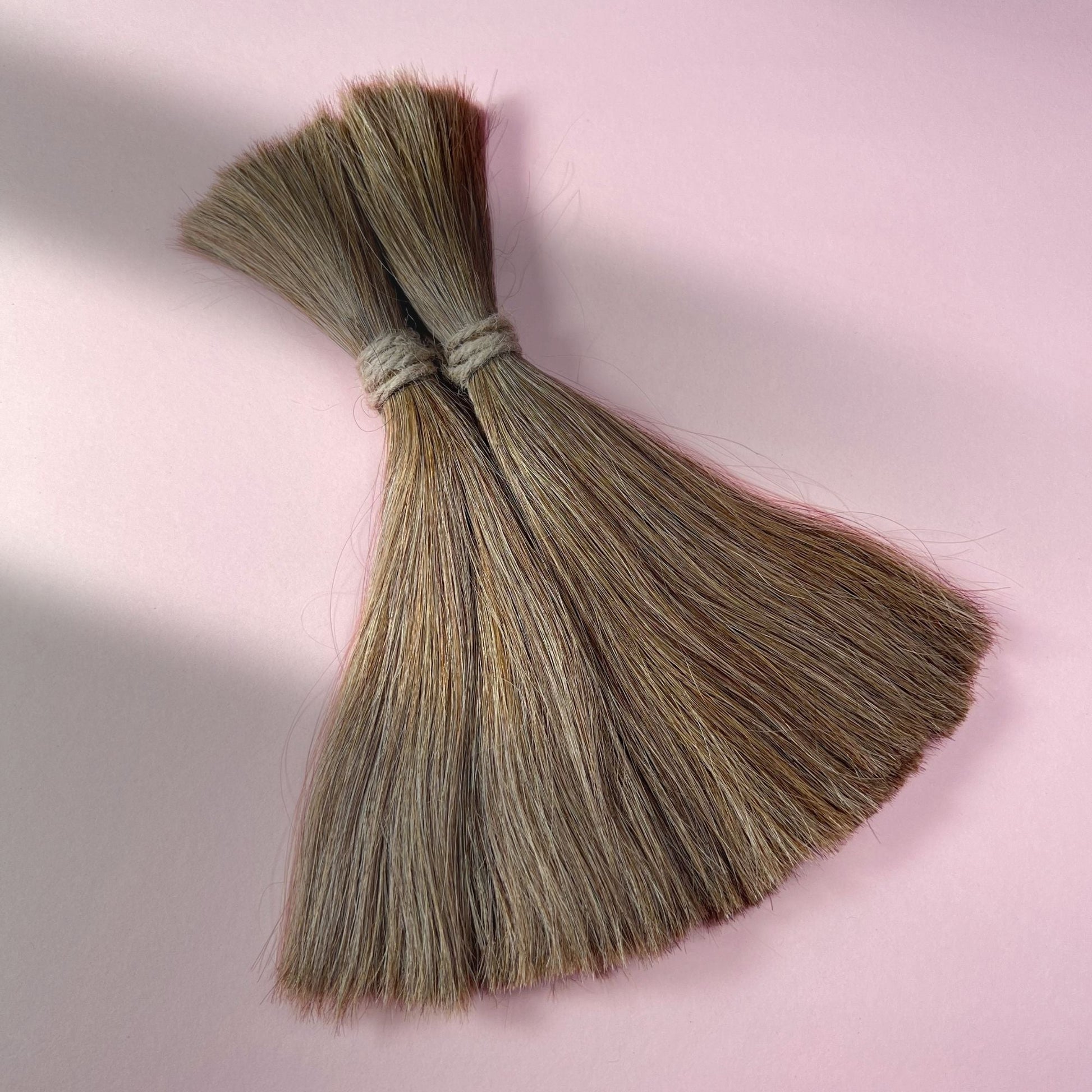 Full view of straight human hair in Light Beige Blonde.