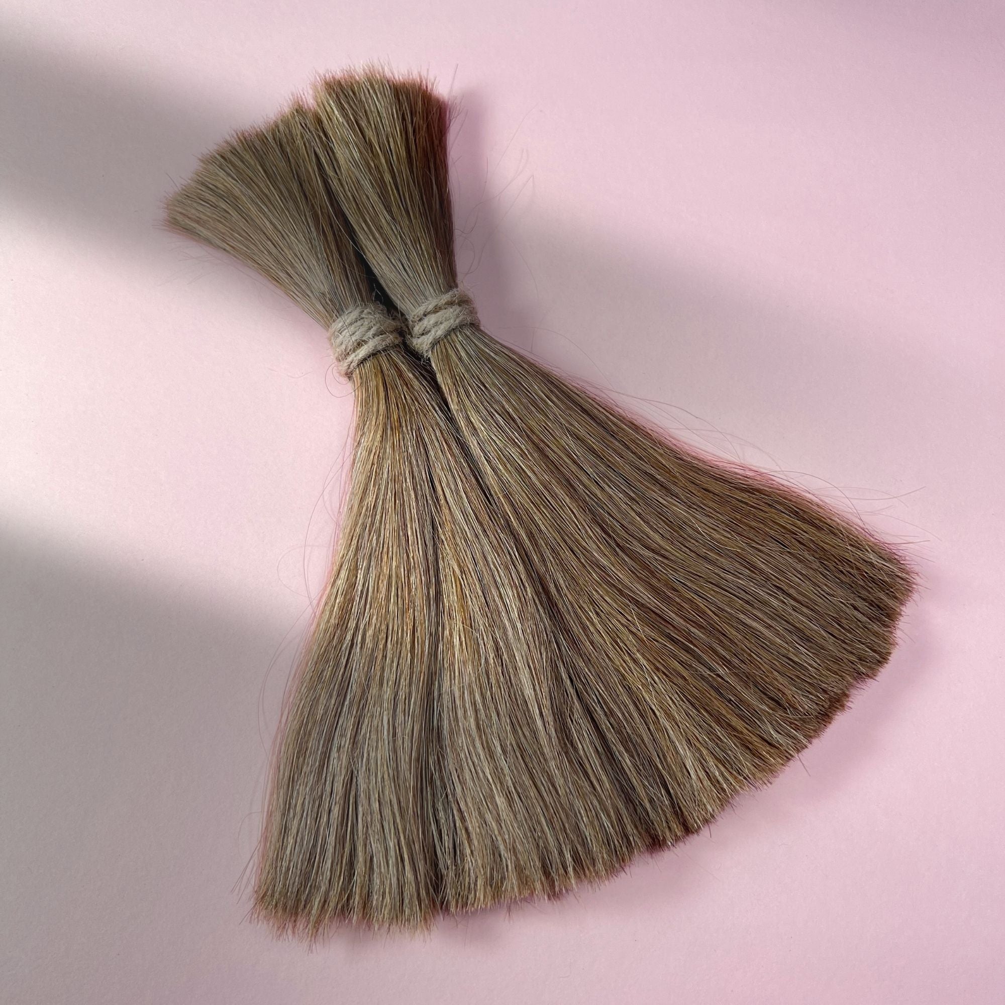Full view of straight human hair in Light Beige Blonde.