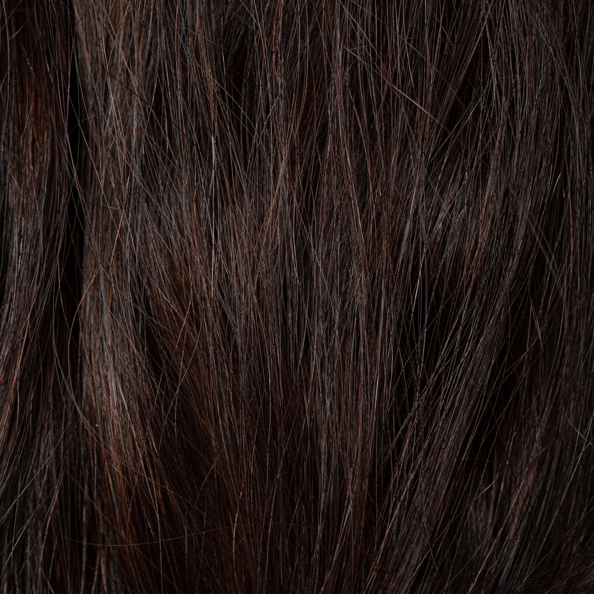 Close-up of Burnt Sugar loose human hair texture for Straight Loc Extensions