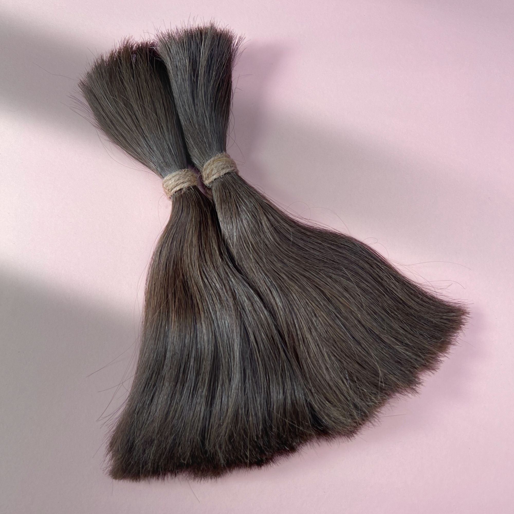 Full view of straight human hair in Dark Wenge Brown.