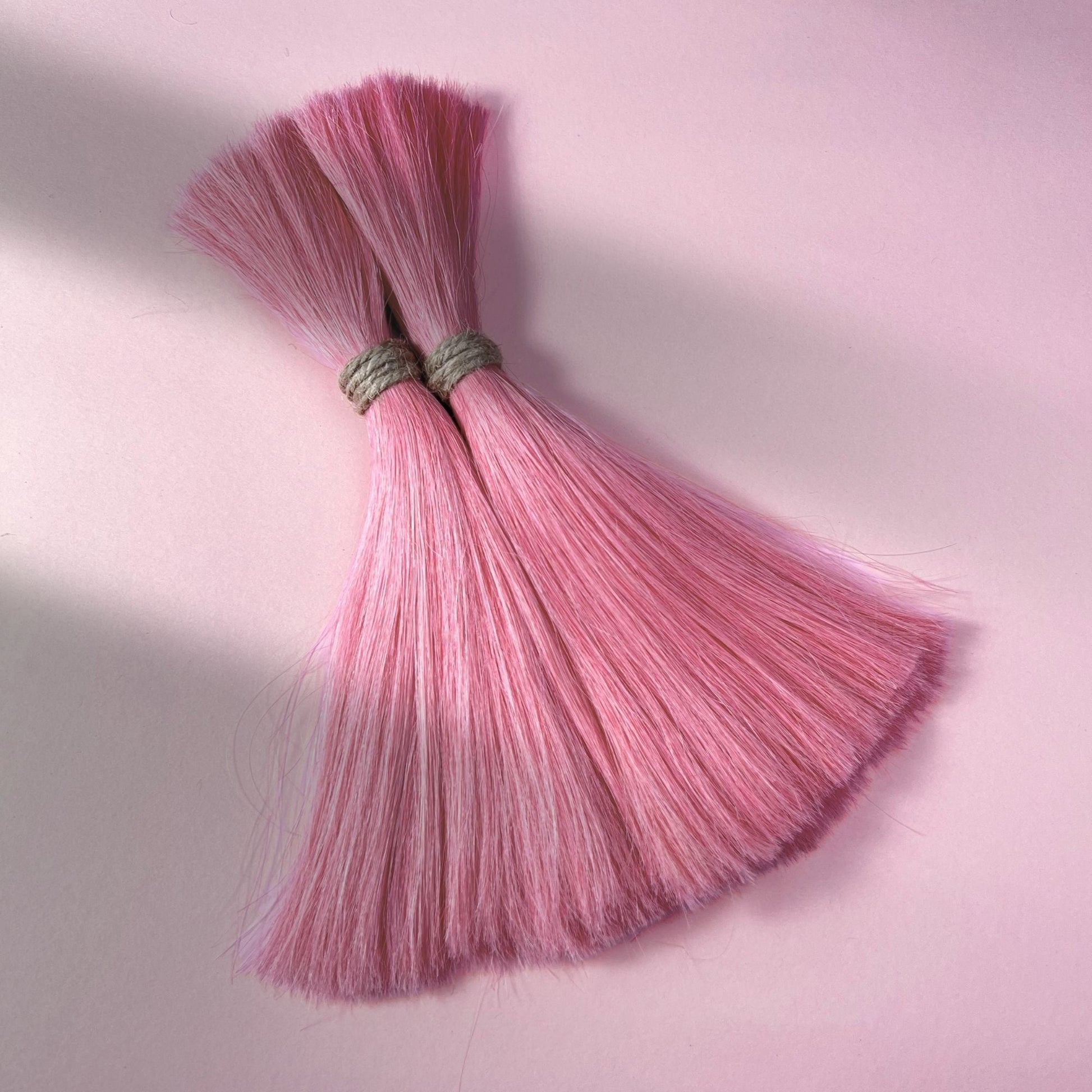 Full view of straight human hair in Bubblegum Pink.