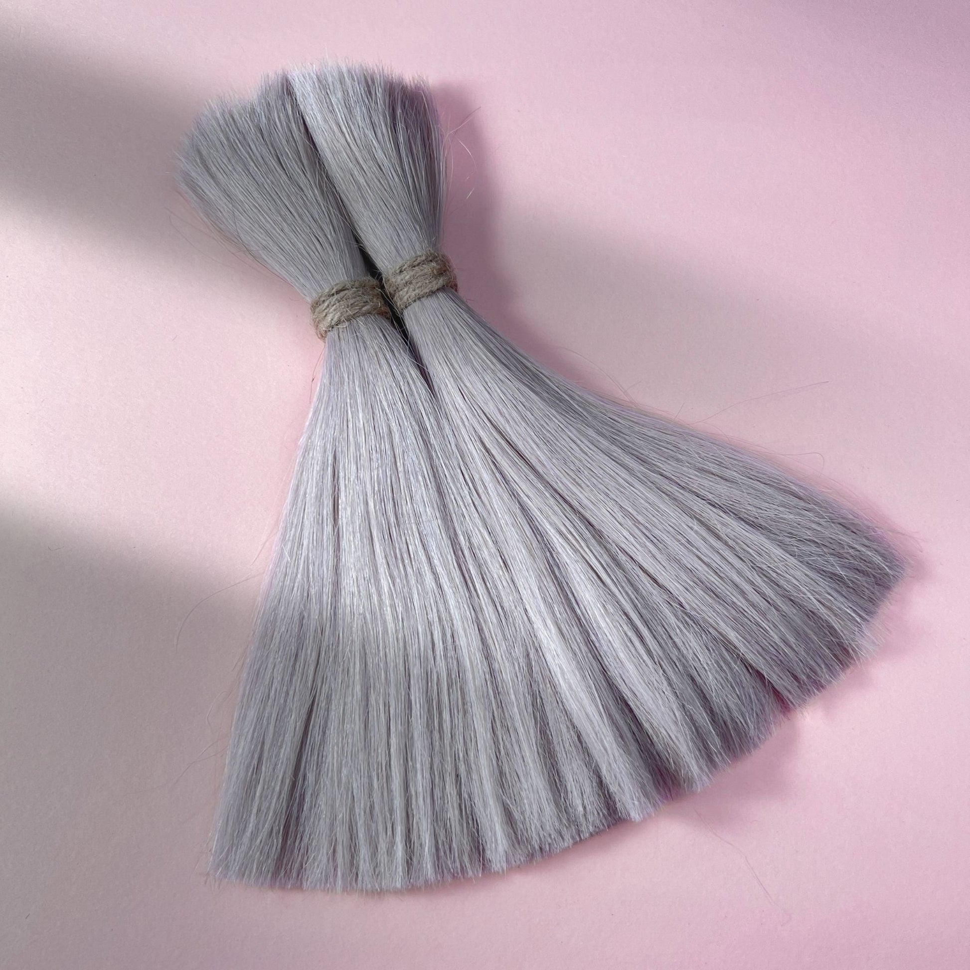 Full view of straight human hair in Pearl Silver.