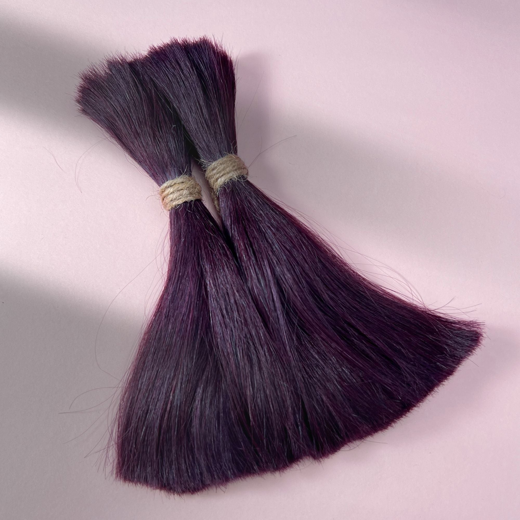 Full view of straight human hair in Warm Marsala Red.