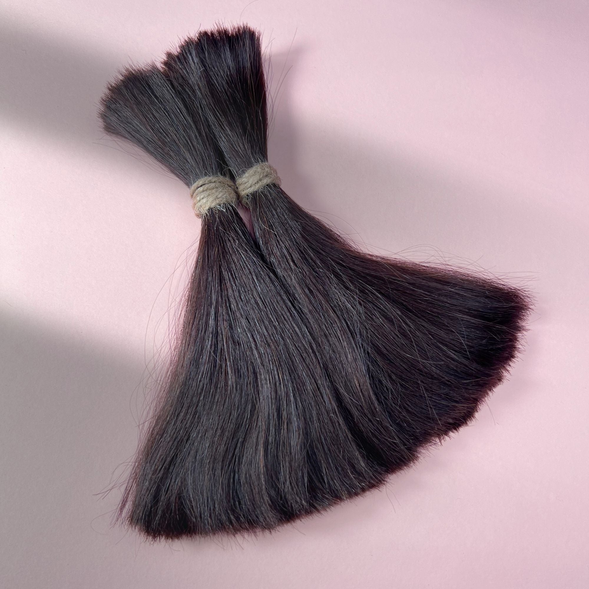 Full view of straight human hair in Deep Brown.