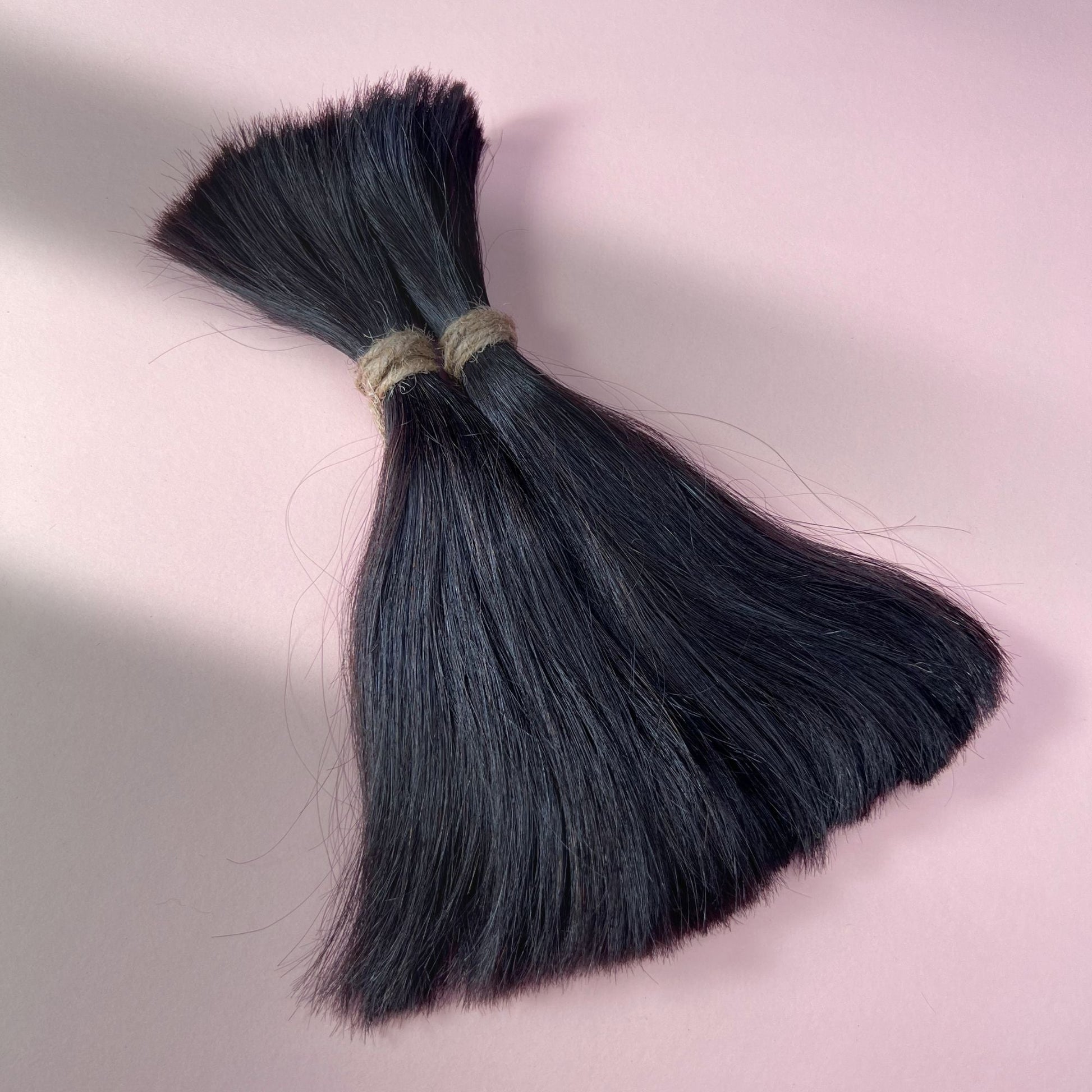 Full view of straight human hair in Dark Ash Brown.