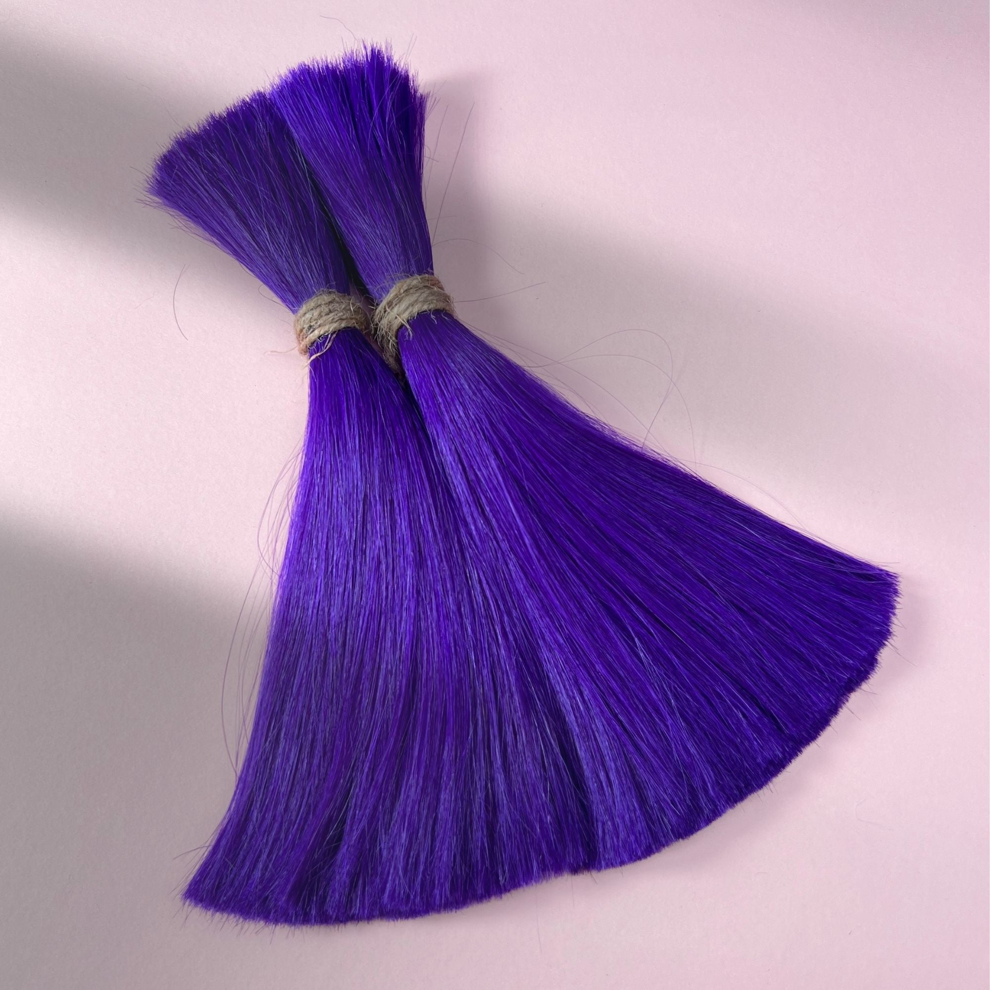 Full view of straight human hair in Orchid Violet.