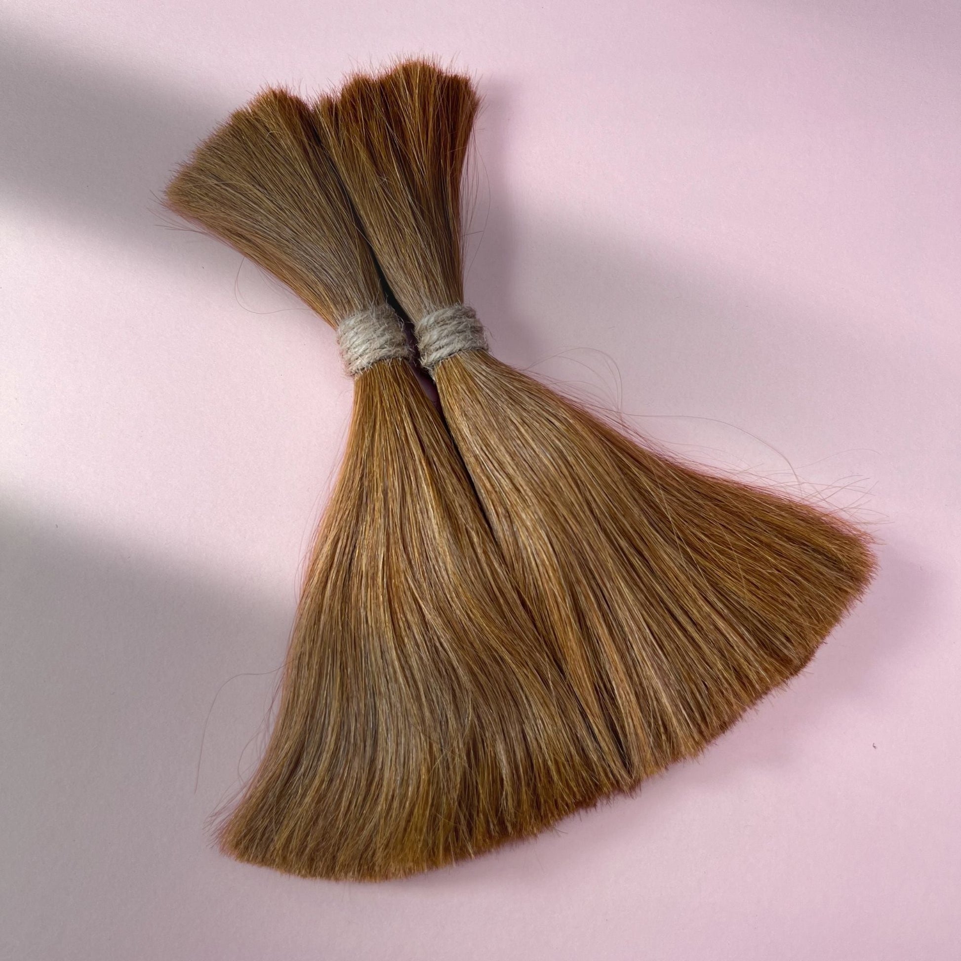 Full view of straight human hair in Warm Chestnut Brown.