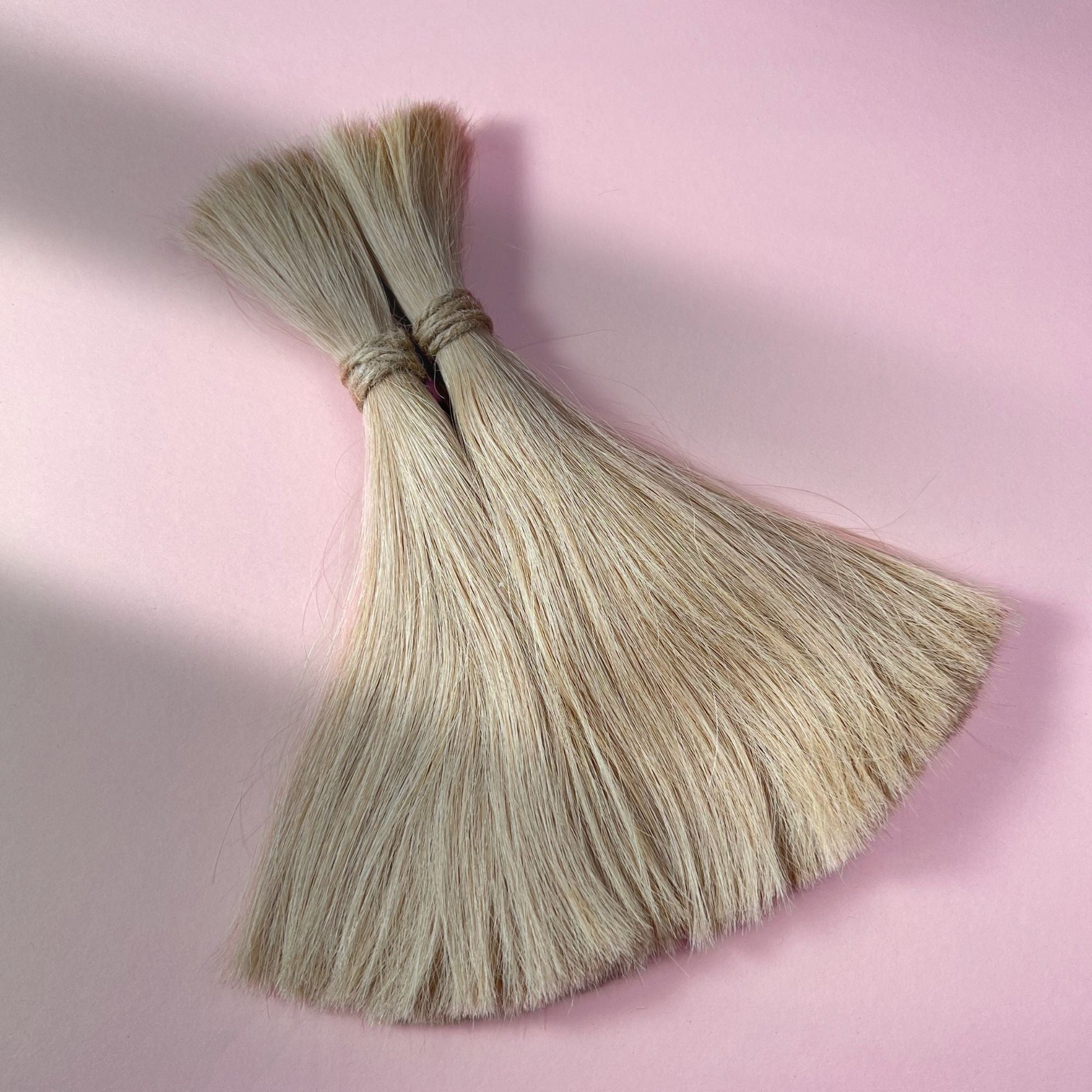 Full view of straight human hair in Sunlit Blonde.
