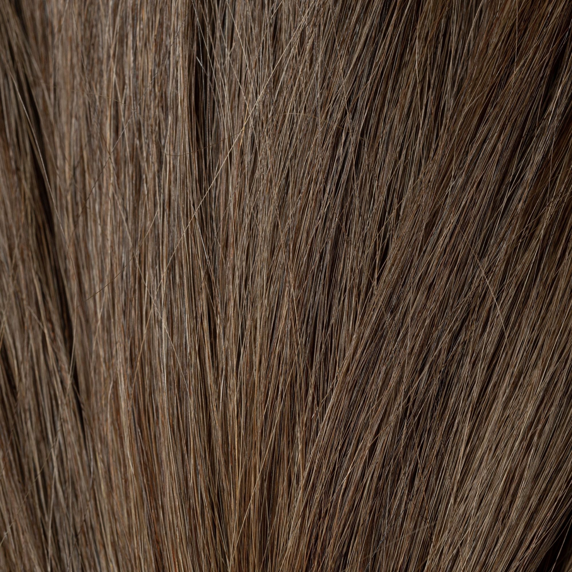 Close-up of Pure Source loose human hair texture for Straight Loc Extensions