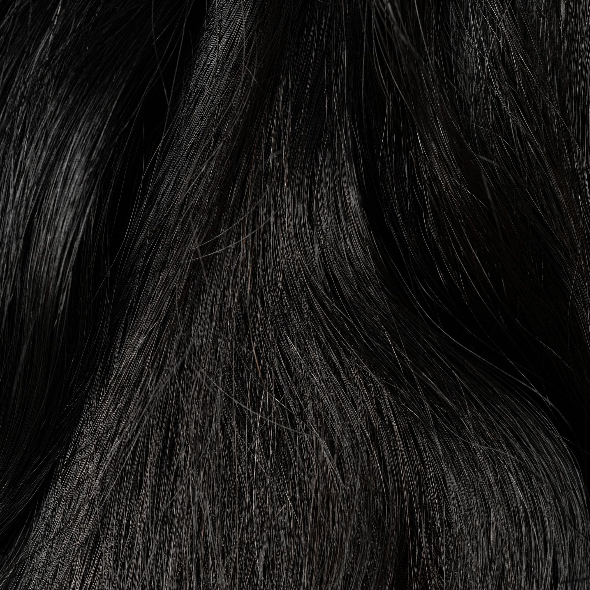 Close-up of Raven's Wing loose human hair texture for Straight Loc Extensions