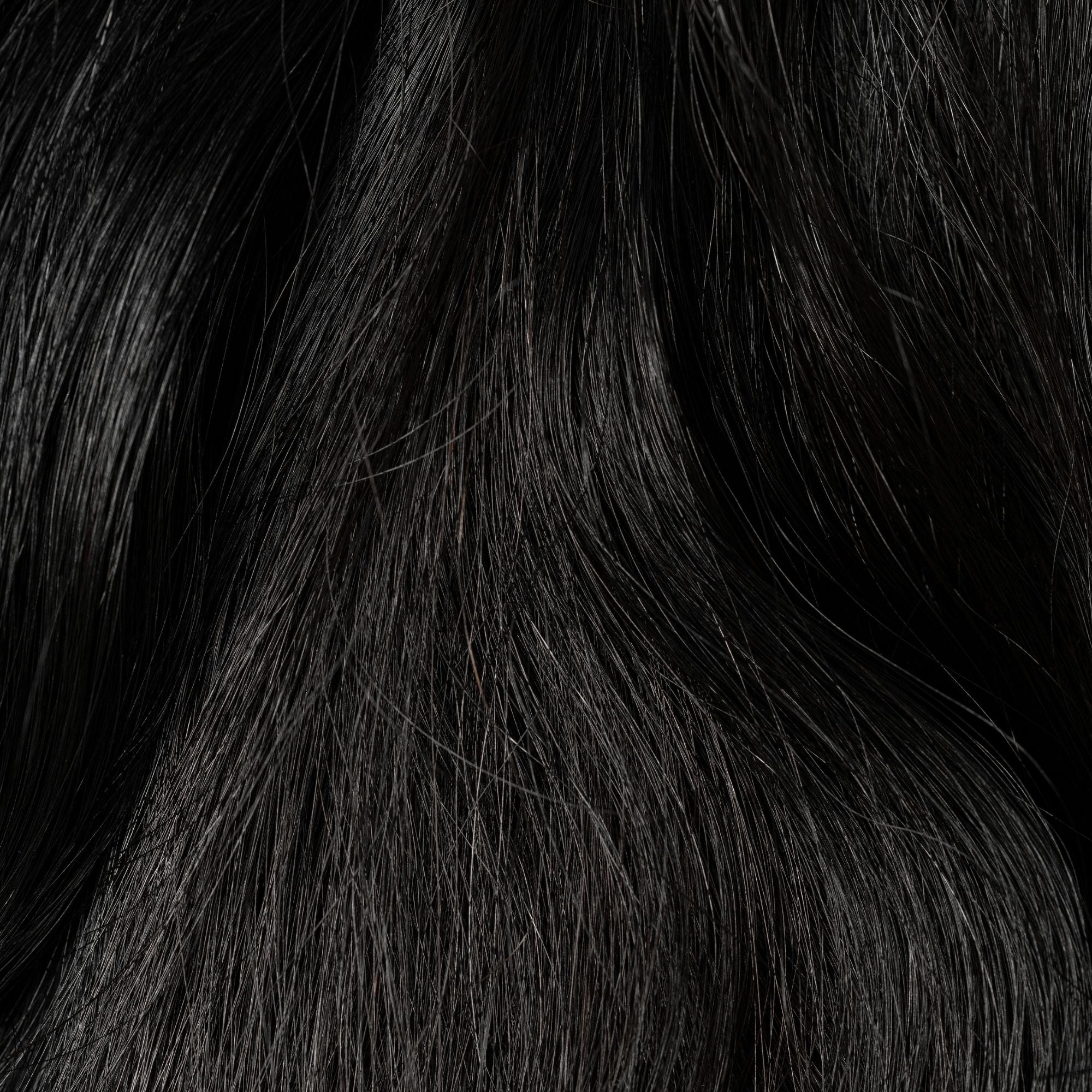Close-up of Raven's Wing loose human hair texture for Straight Loc Extensions