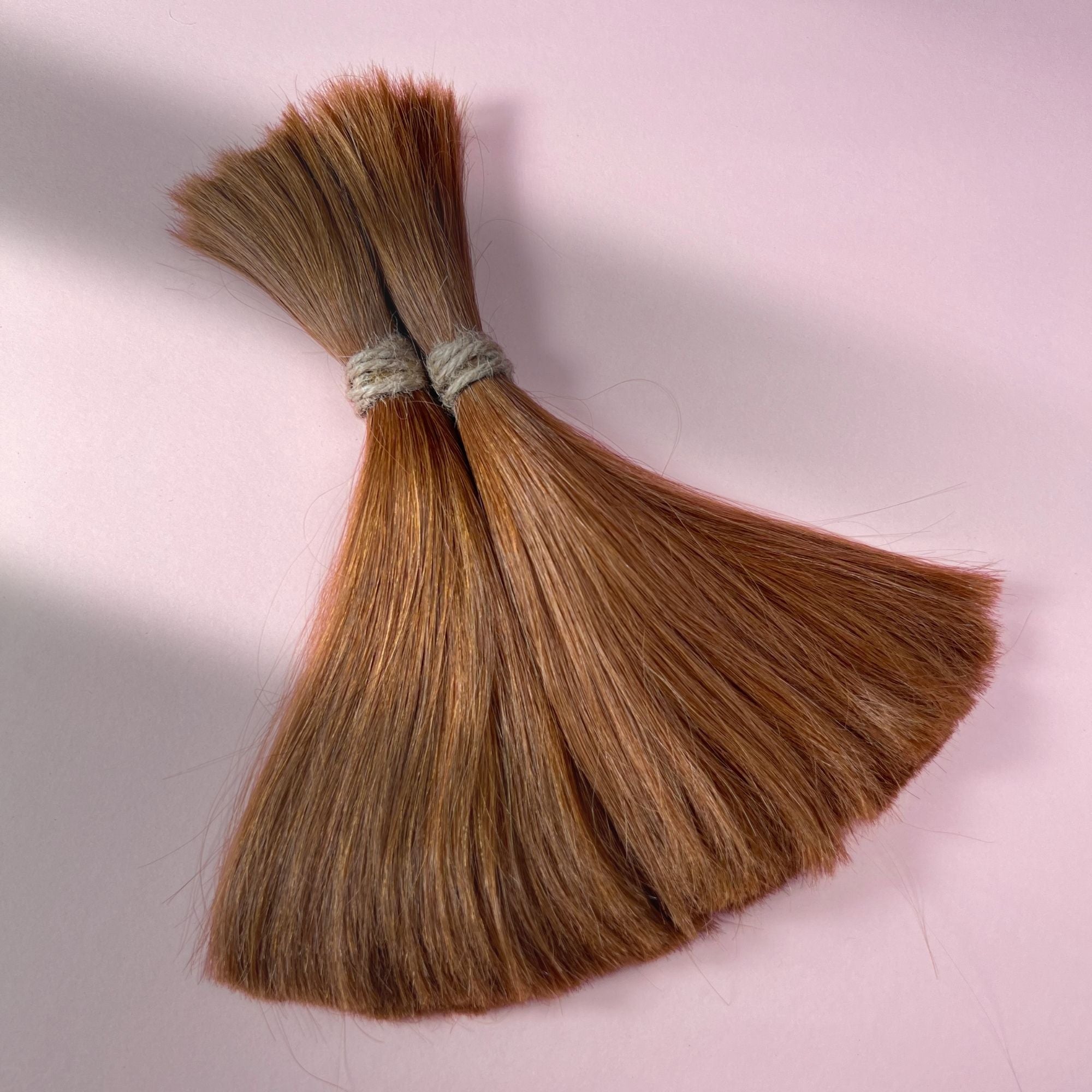 Full view of straight human hair in Auburn Copper.