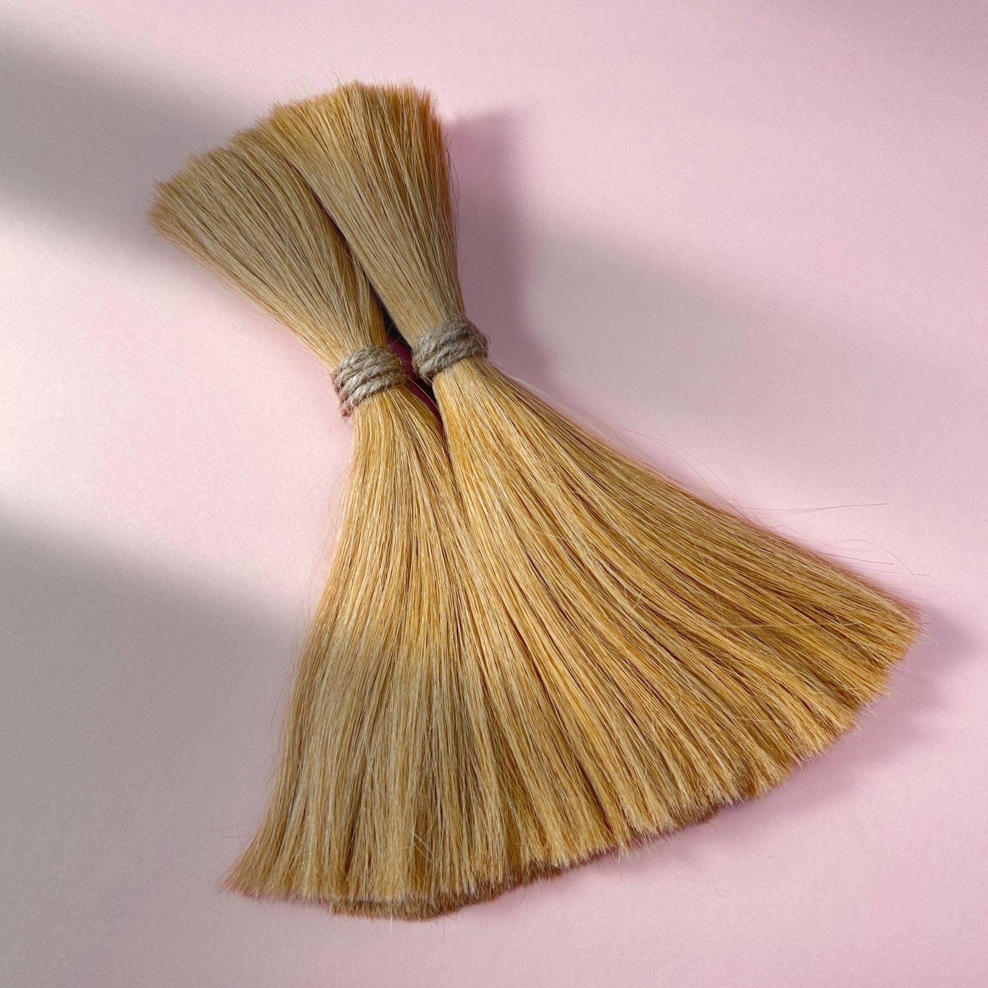 Full view of straight human hair in Sunkissed Blonde.