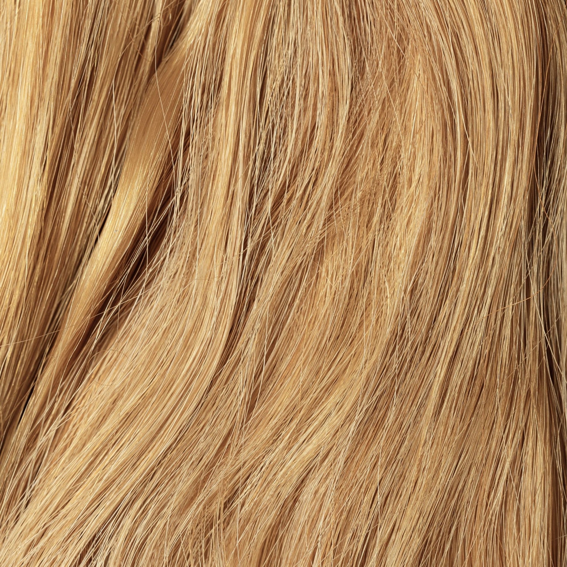 Close-up of Sunkissed loose human hair texture for Straight Loc Extensions