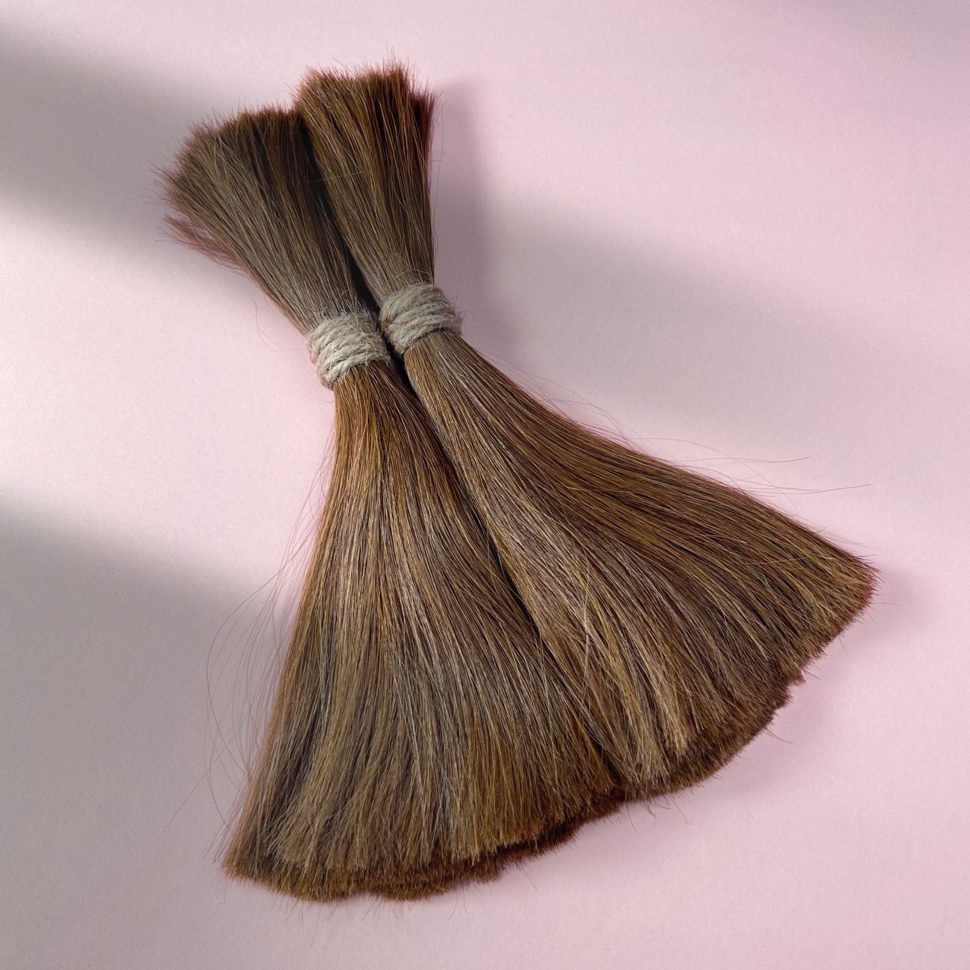 Full view of straight human hair in Warm Golden Brown.