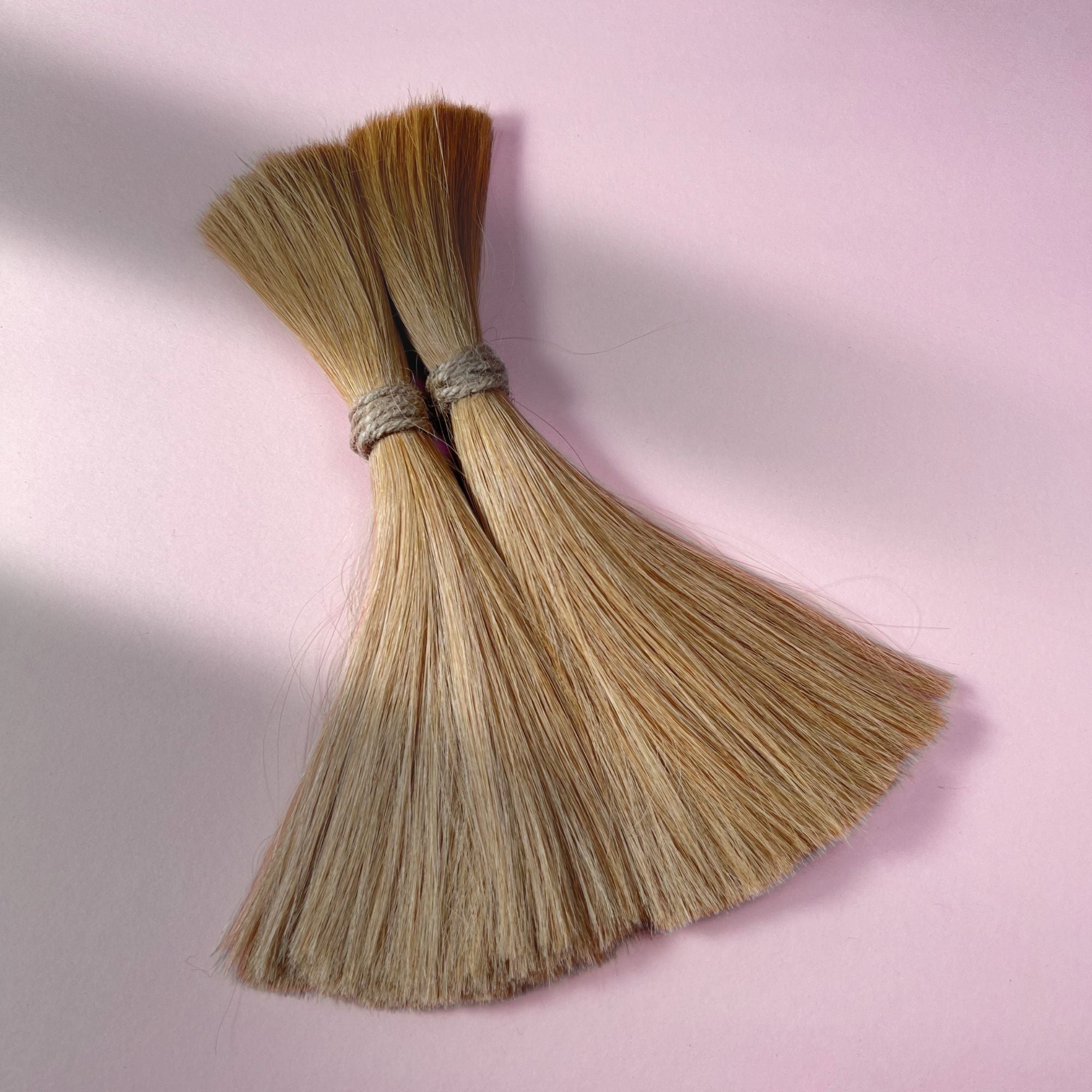 Full view of straight human hair in Warm Beige Blonde.