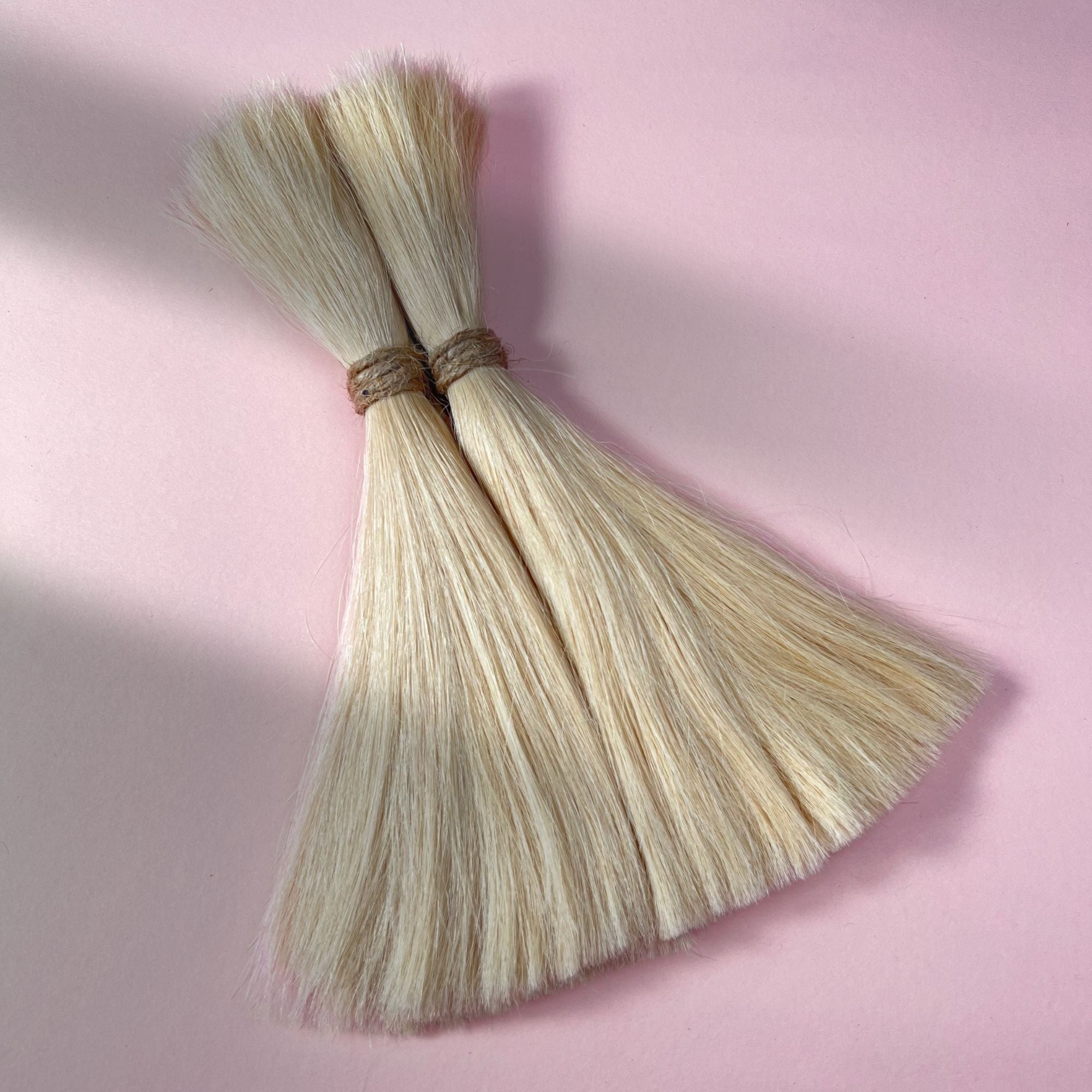 Full view of straight human hair in Wheat Blonde.