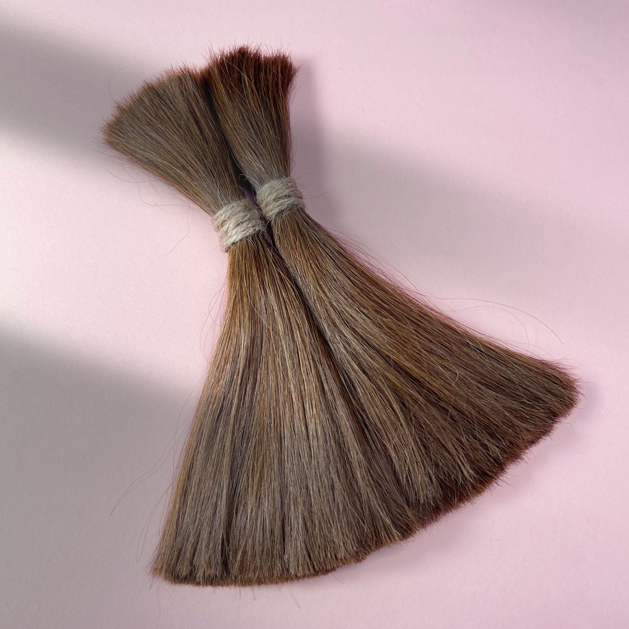 Full view of straight human hair in Medium Brown.