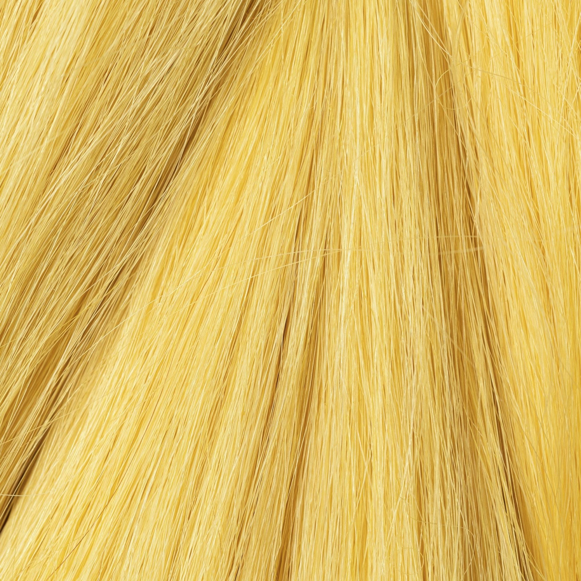Close-up of Yellow Ochre loose human hair texture for Straight Loc Extensions