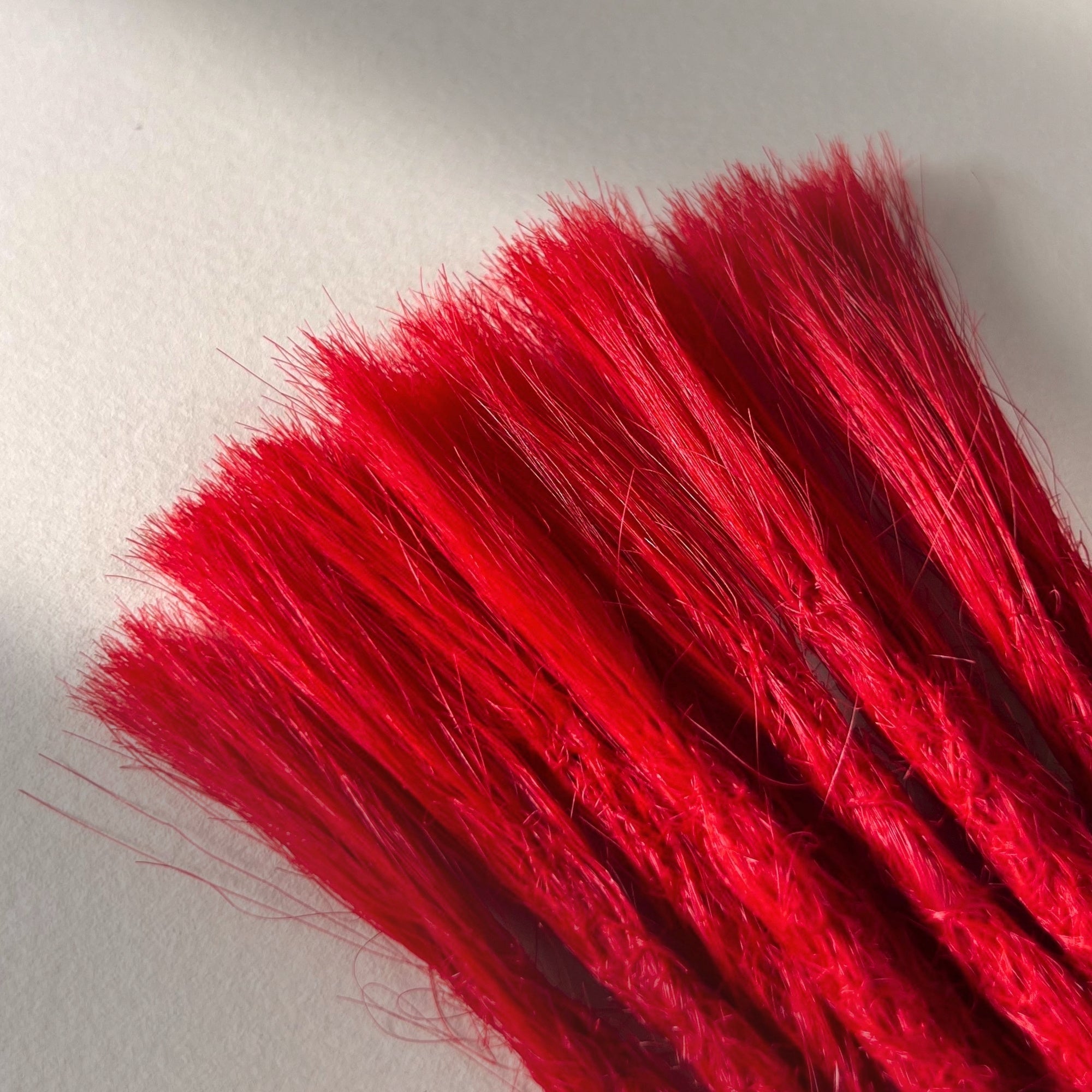 Connection point of permanent straight loc extensions in Flame Red.