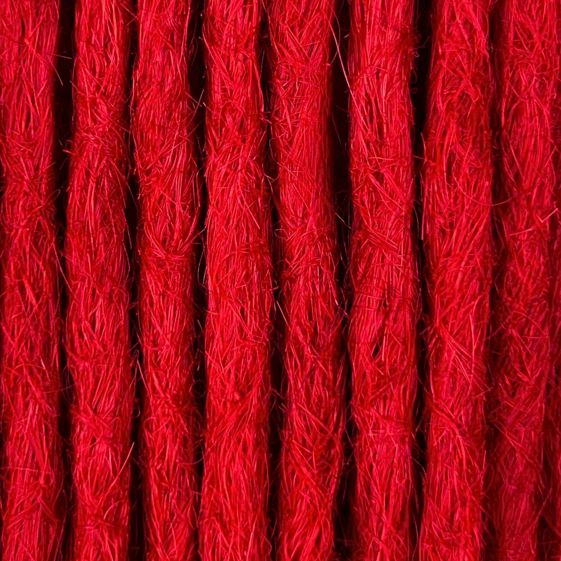 Close-up of straight loc extensions in Flame Red, showing the texture and color.