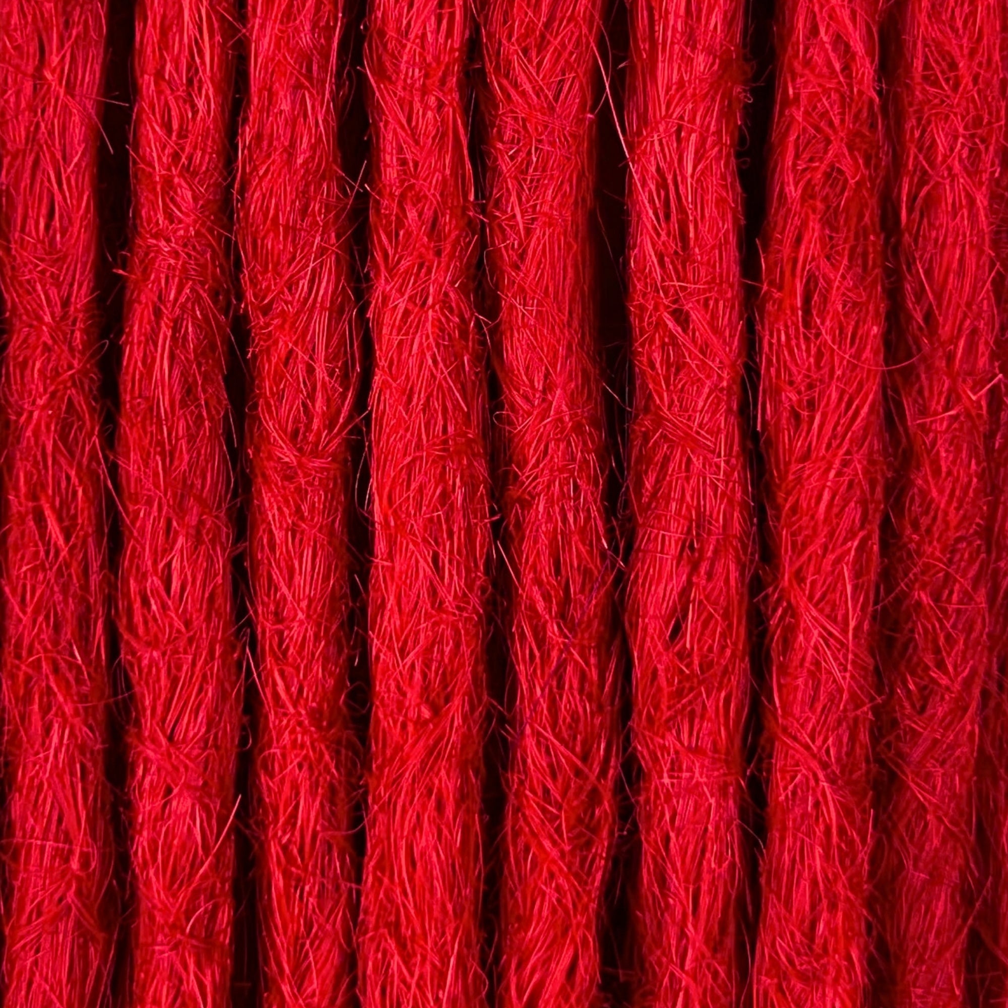 Close-up of straight loc extensions in Flame Red, showing the texture and color.