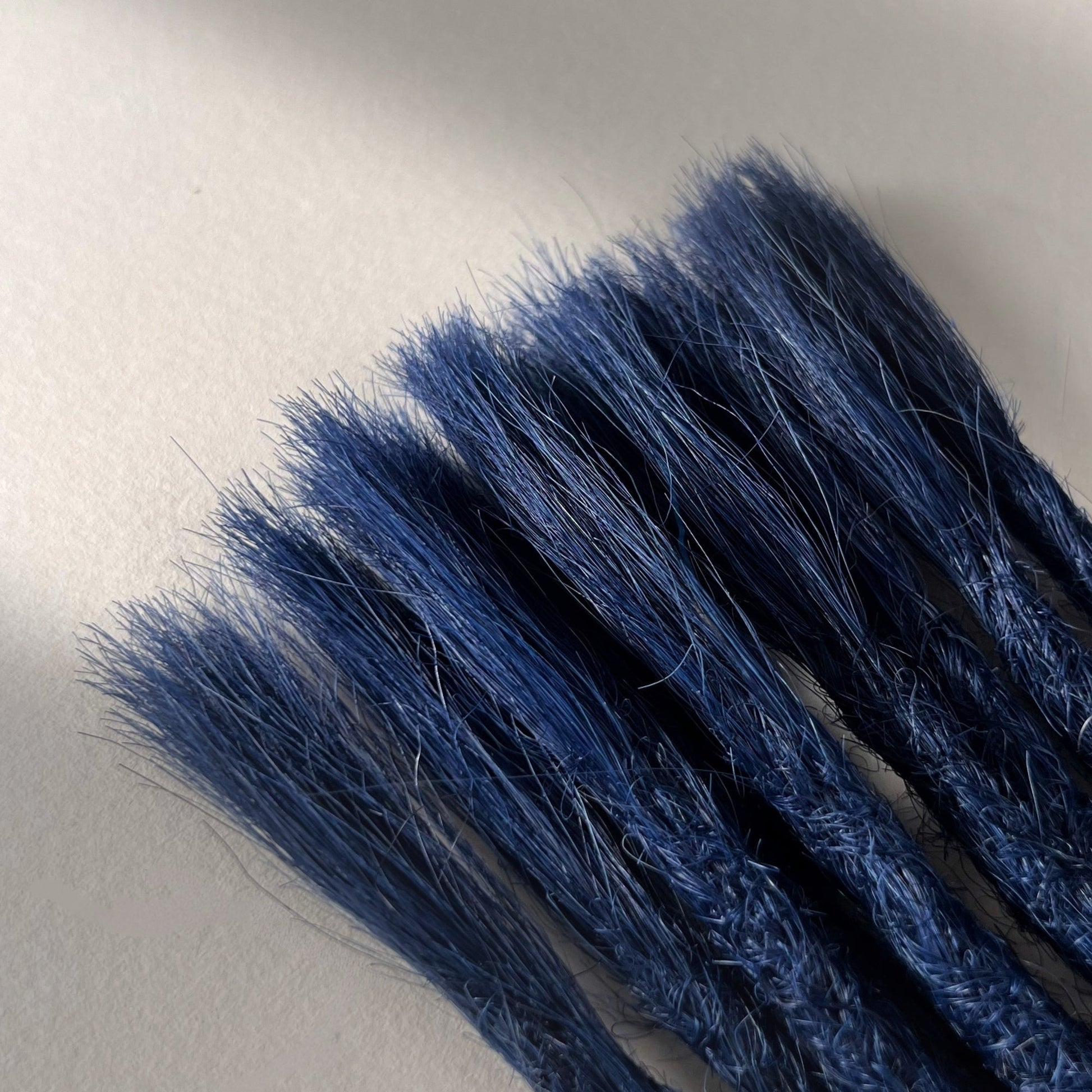 Connection point of permanent straight loc extensions in Midnight Blue.