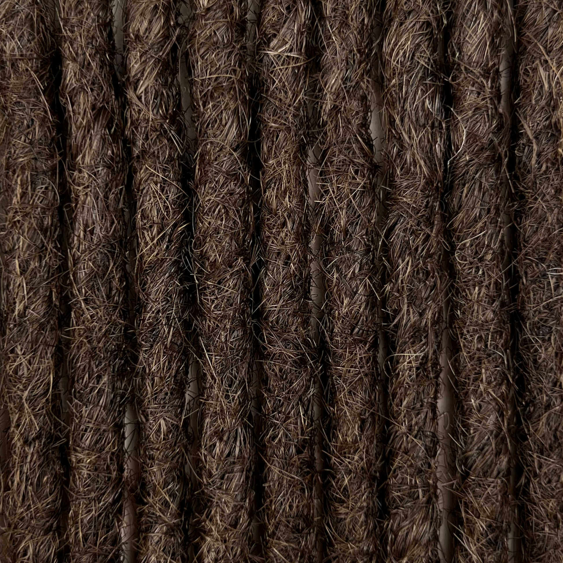 Close-up of straight loc extensions in Dark Wenge Brown, showing the texture and color.