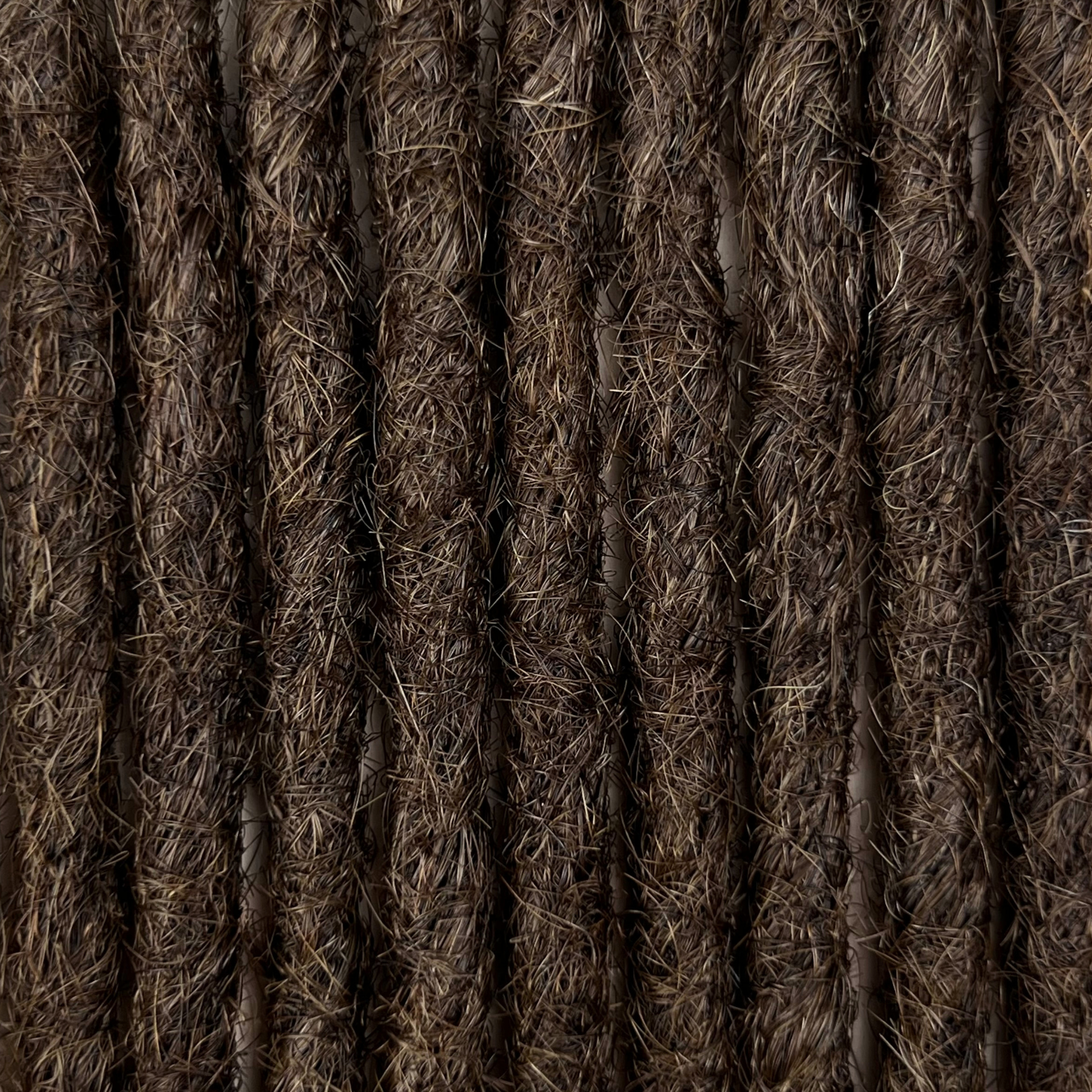 Close-up of straight loc extensions in Dark Wenge Brown, showing the texture and color.