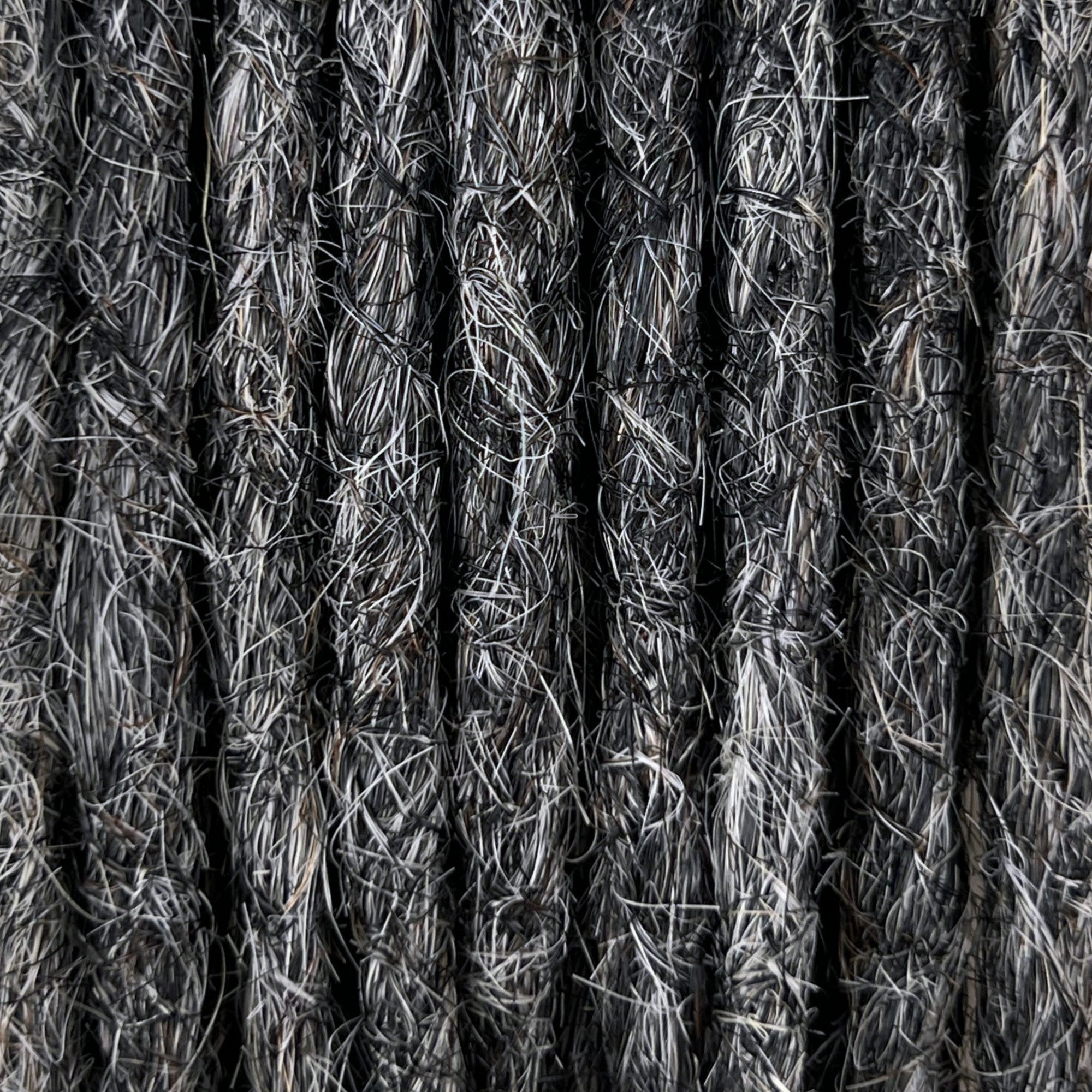 Close-up of straight loc extensions in Steel Silver, showing the texture and color.