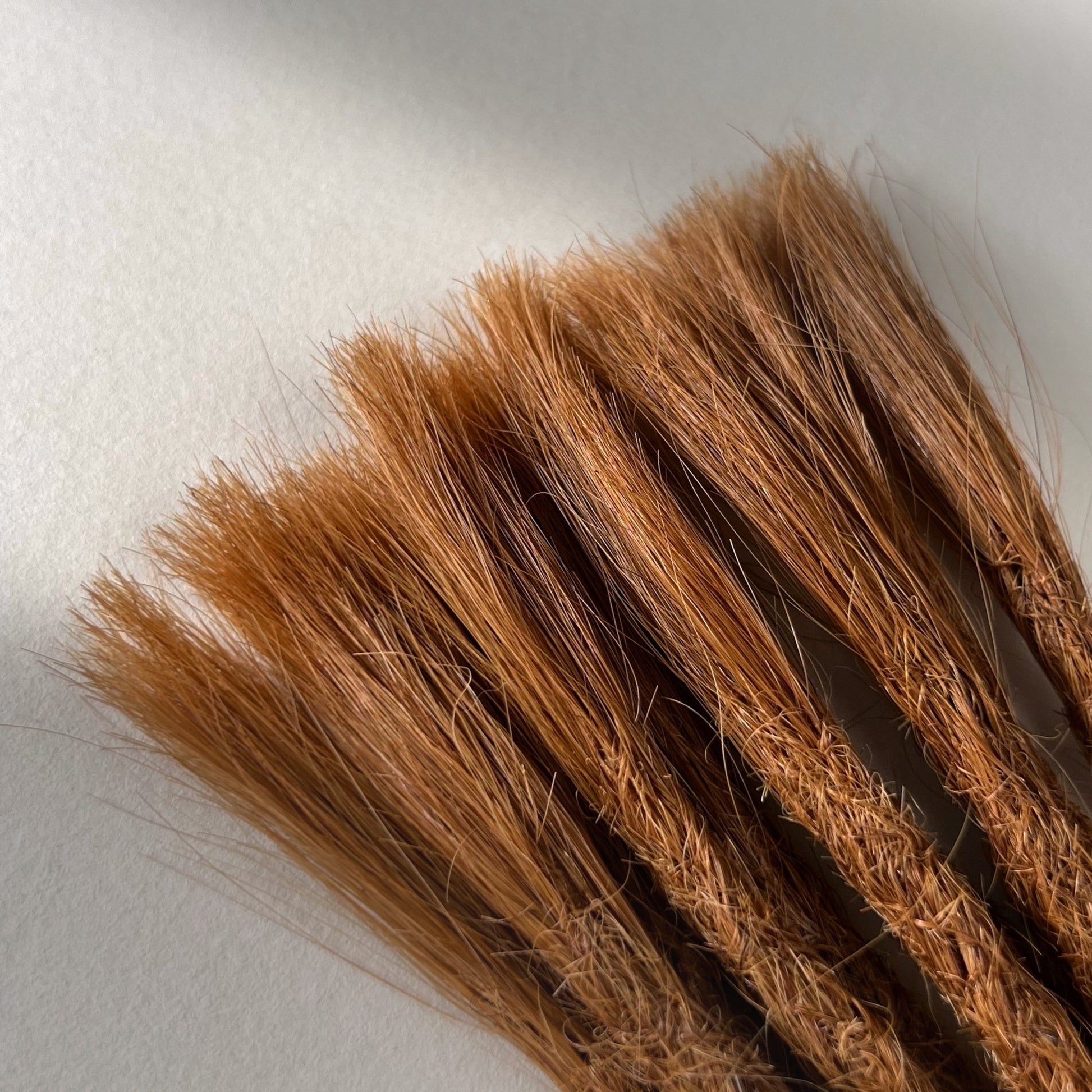 Connection point of permanent straight loc extensions in Burnt Copper.