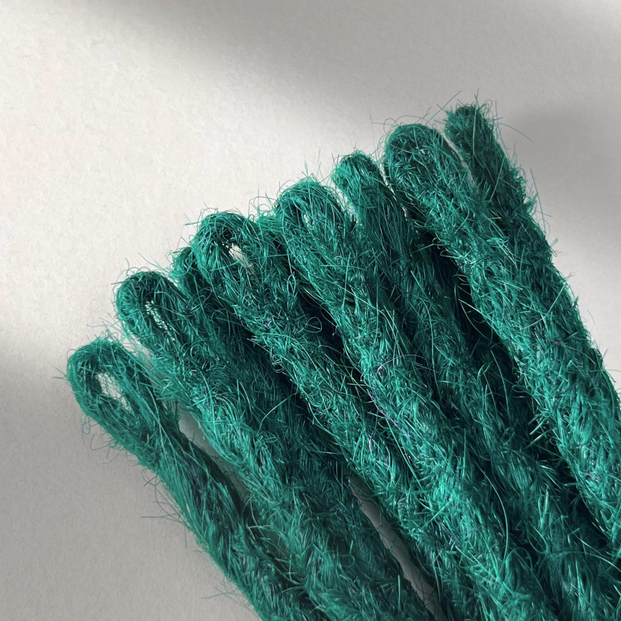 Loop detail of temporary single-ended straight loc extensions in Forest Green.