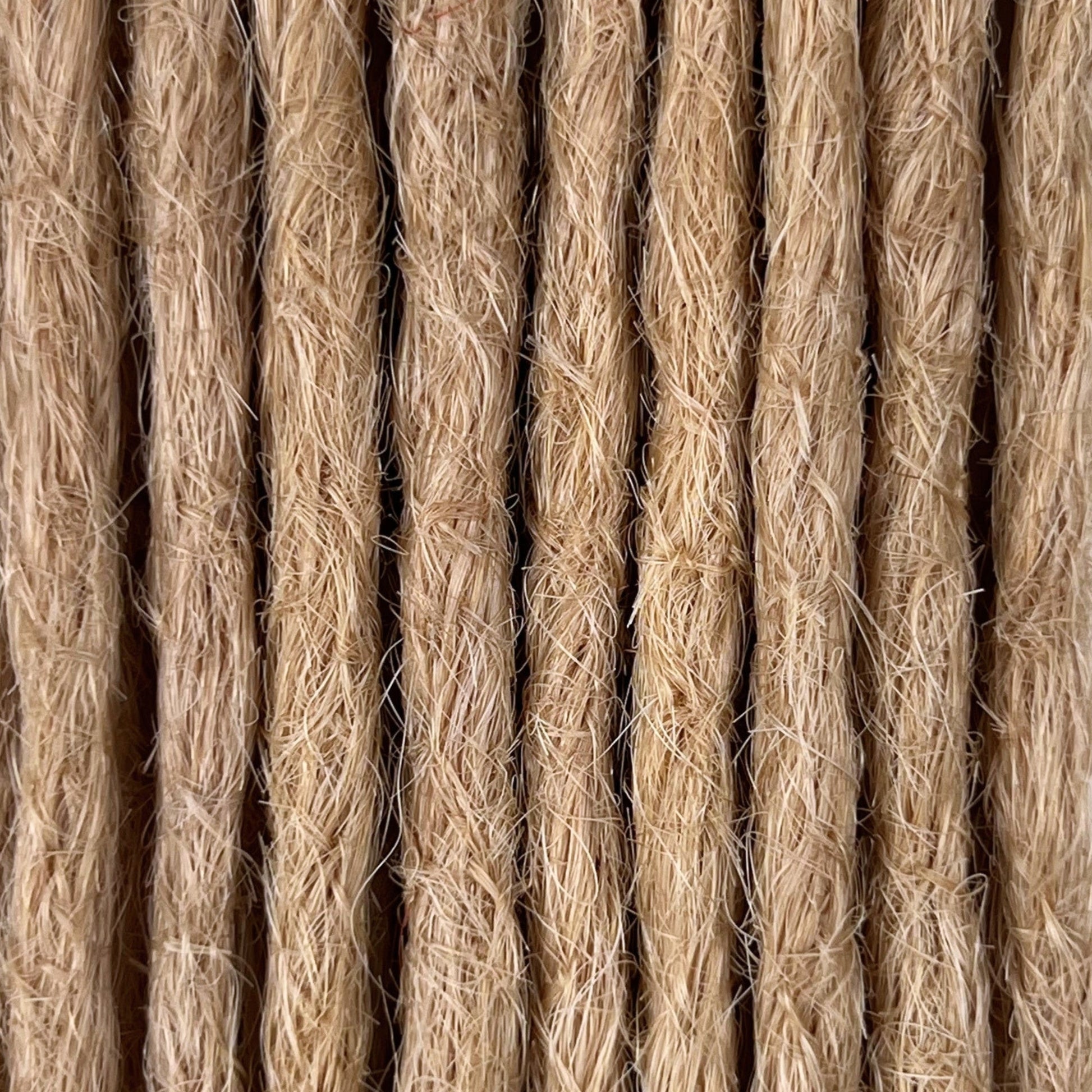 Close-up of straight loc extensions in Vanilla Blonde, showing the texture and color.