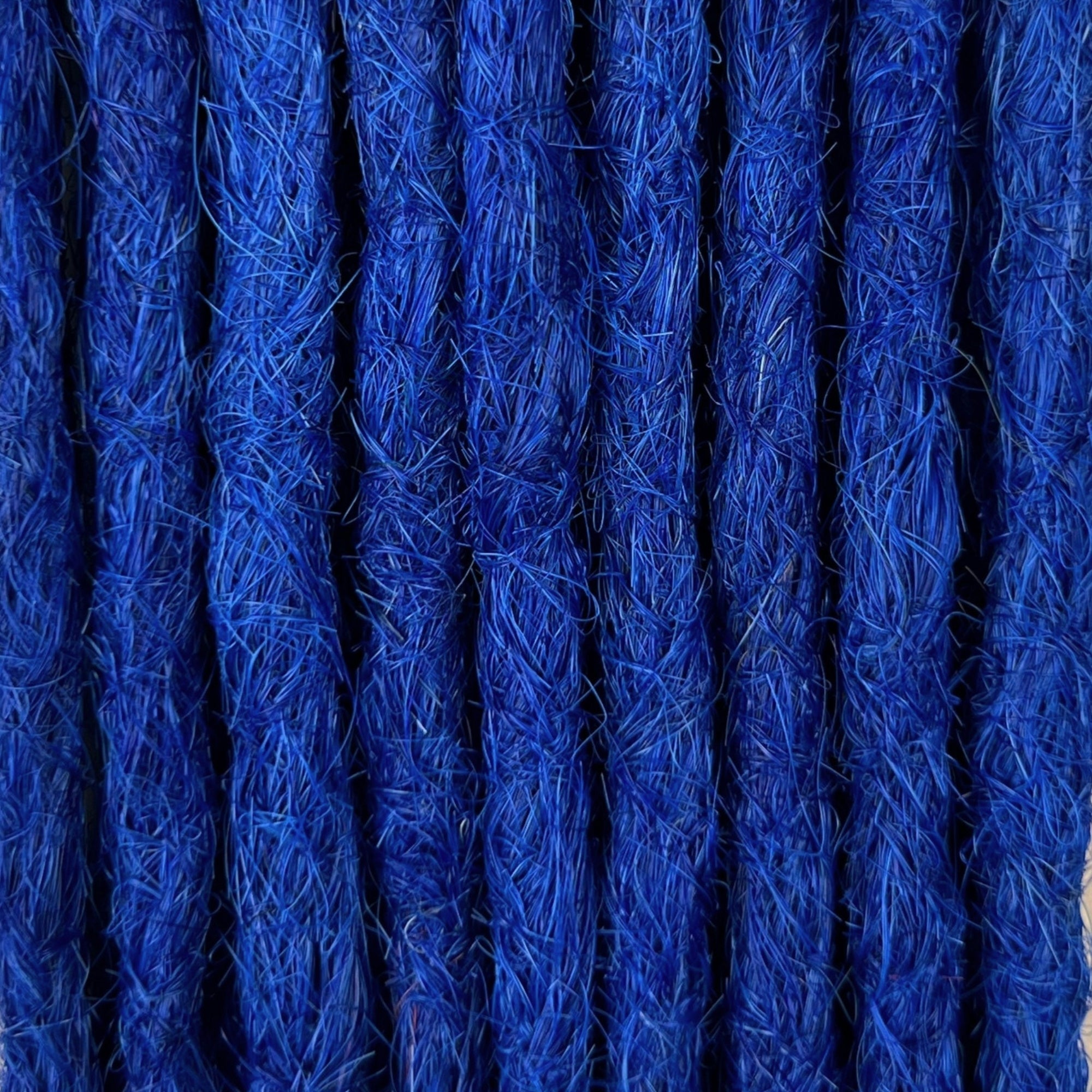 Close-up of straight loc extensions in Deep Navy Blue, showing the texture and color.