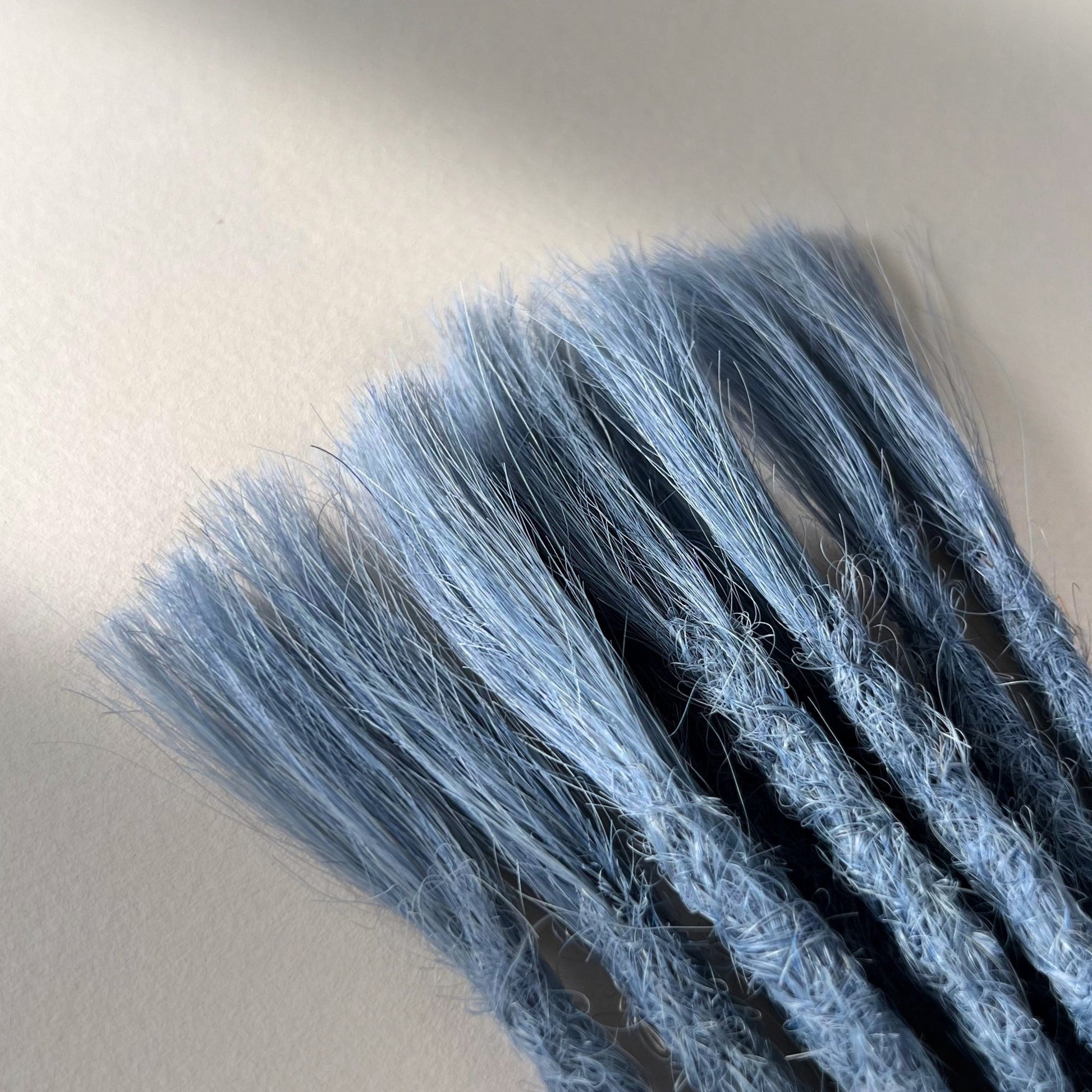 Connection point of permanent straight loc extensions in Sky Blue.