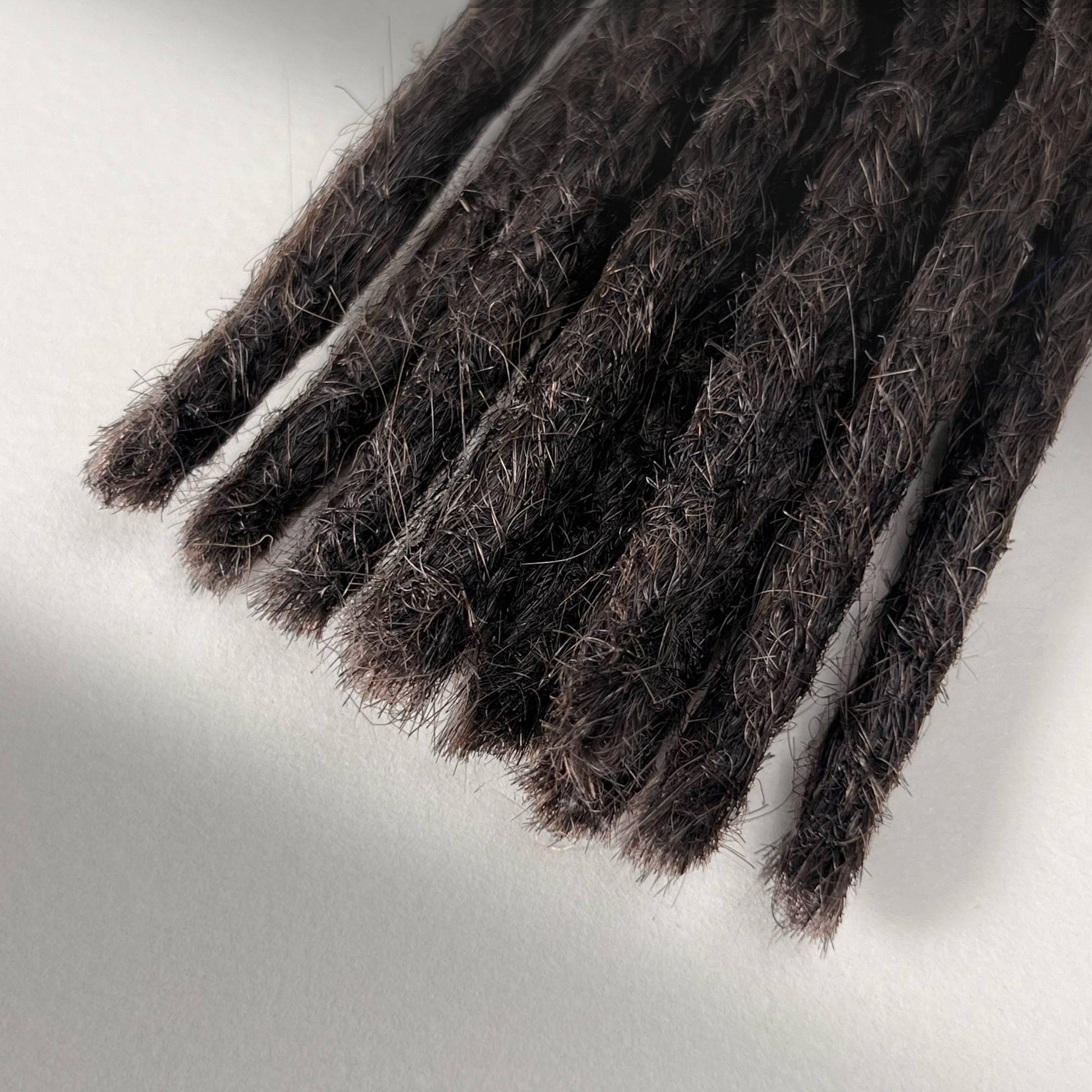 Tip detail of straight loc extensions with blunt ends in Warm Espresso Brown.