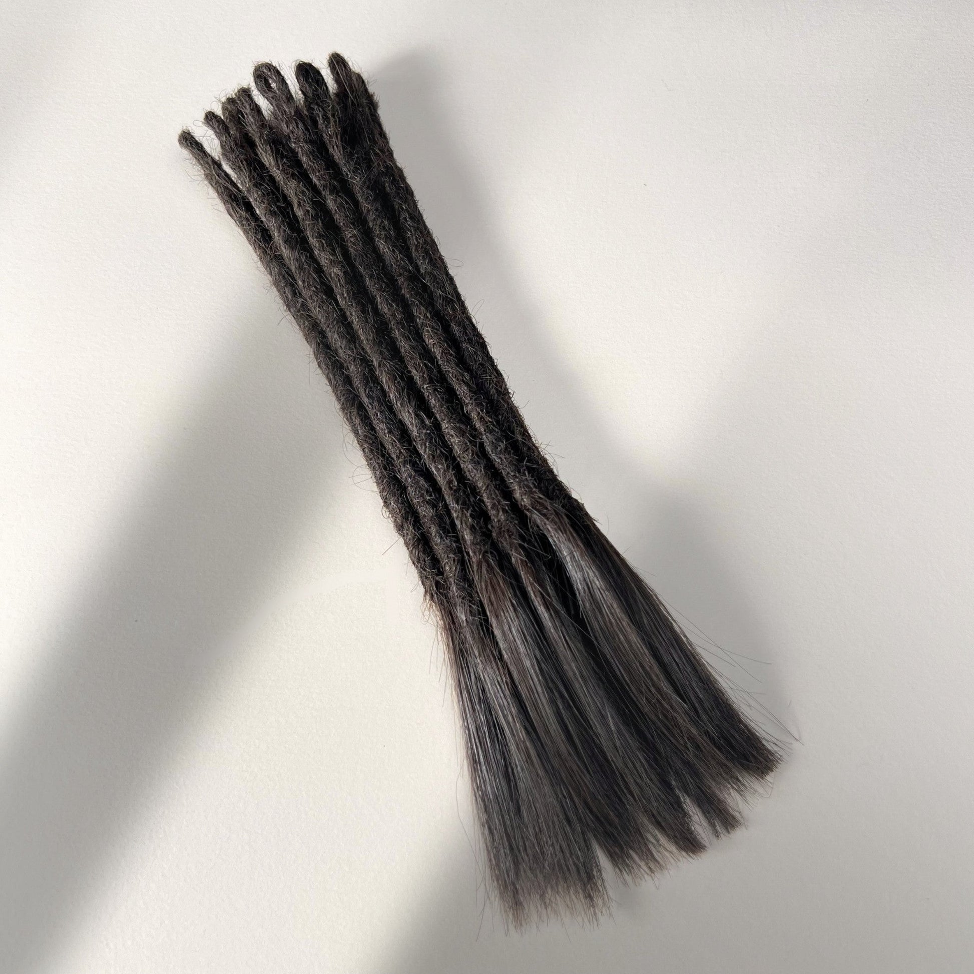 Full view of temporary single-ended straight loc extensions with open ends in Warm Espresso Brown.